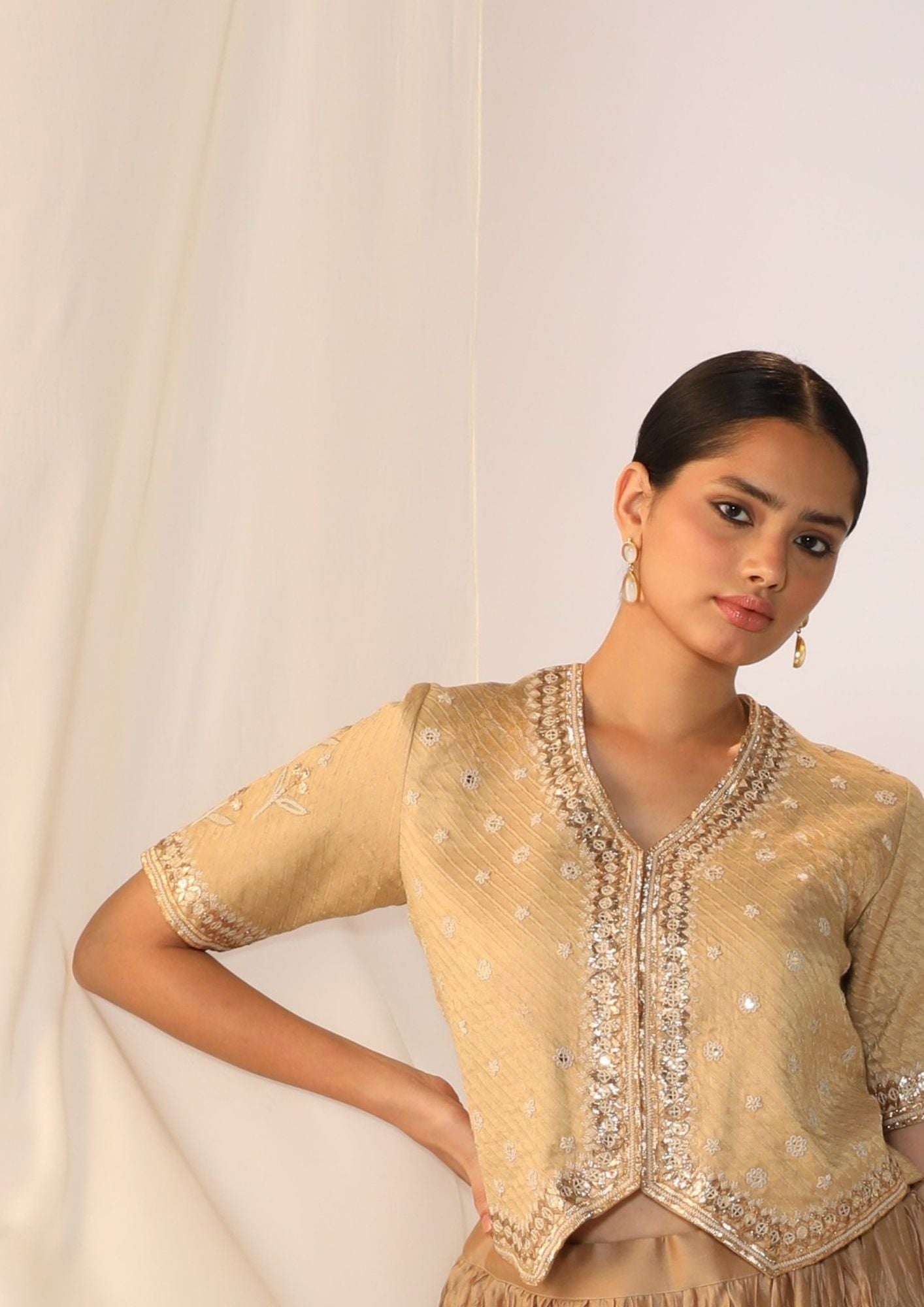 Brocade waistcoat paired with a crushed skirt with benarasi dupatta