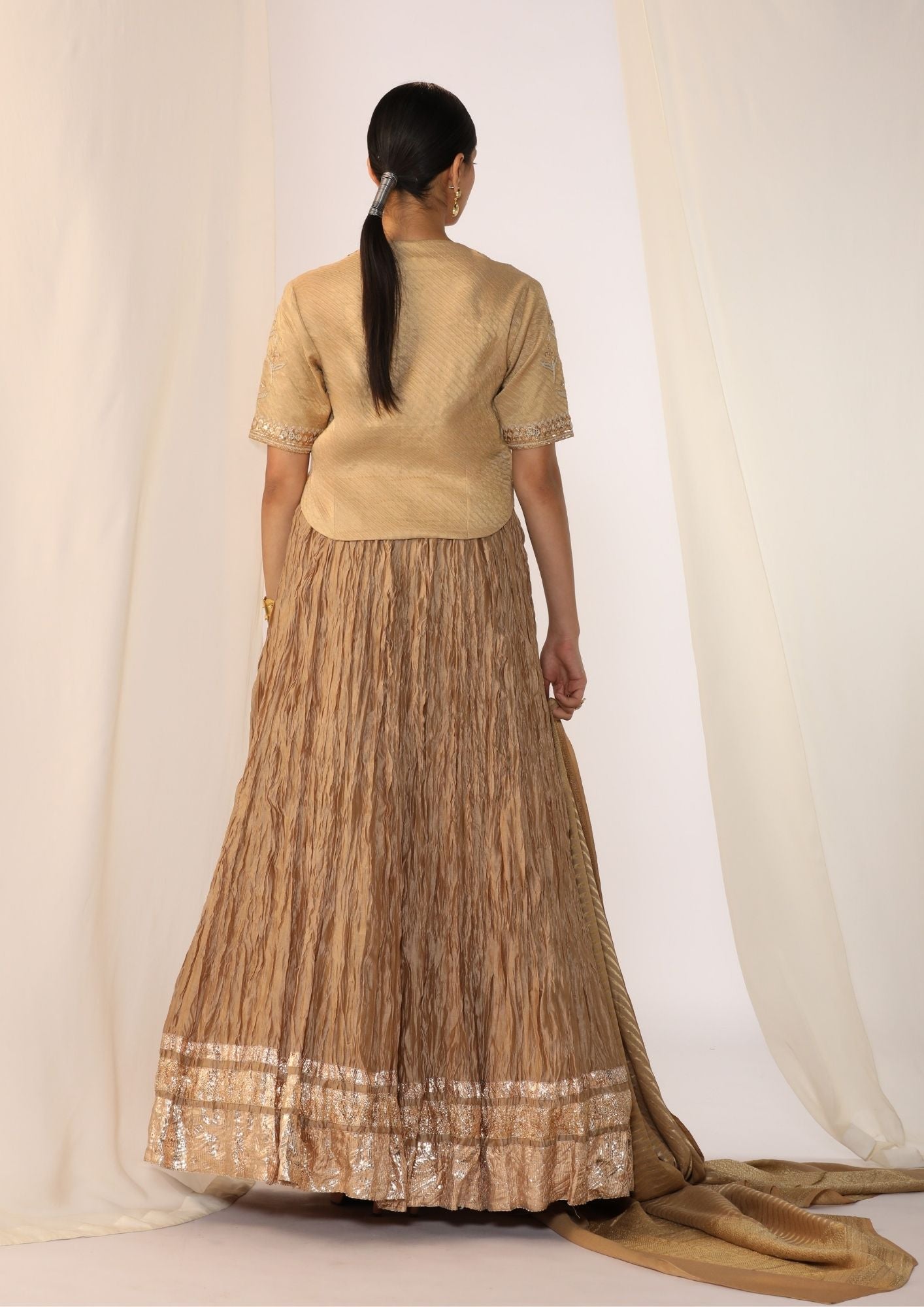 Brocade waistcoat paired with a crushed skirt with benarasi dupatta