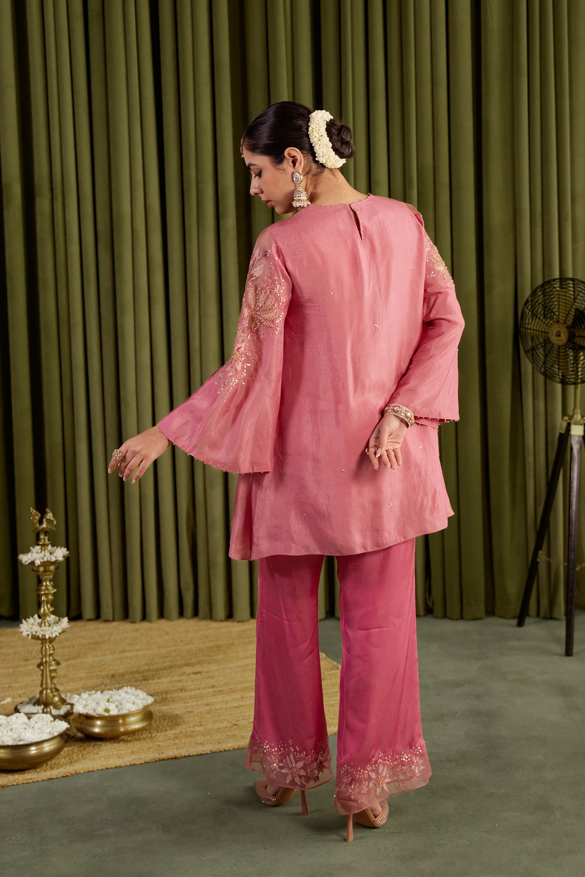 Rose pink co-ord set with embroidered magnolia flower pattern.