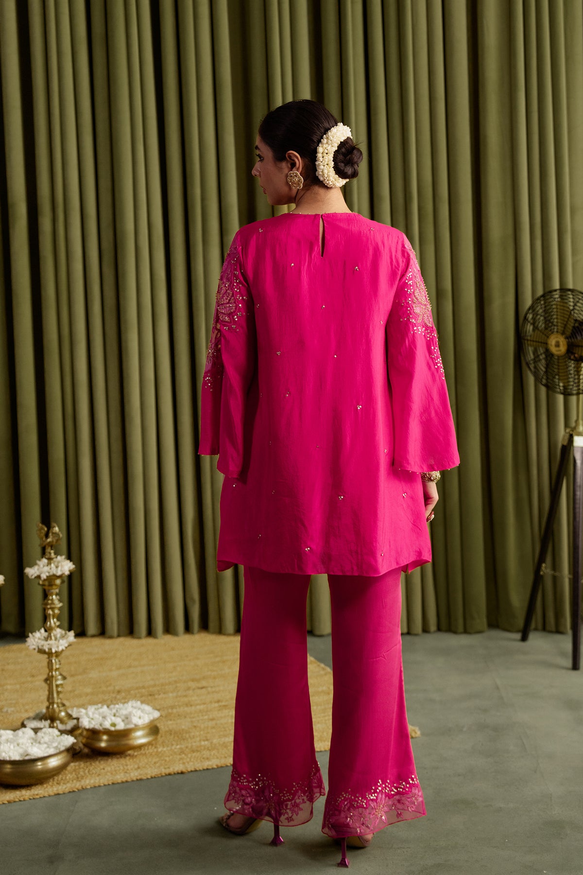 Hot pink co-ord set with embroidered magnolia flower pattern.