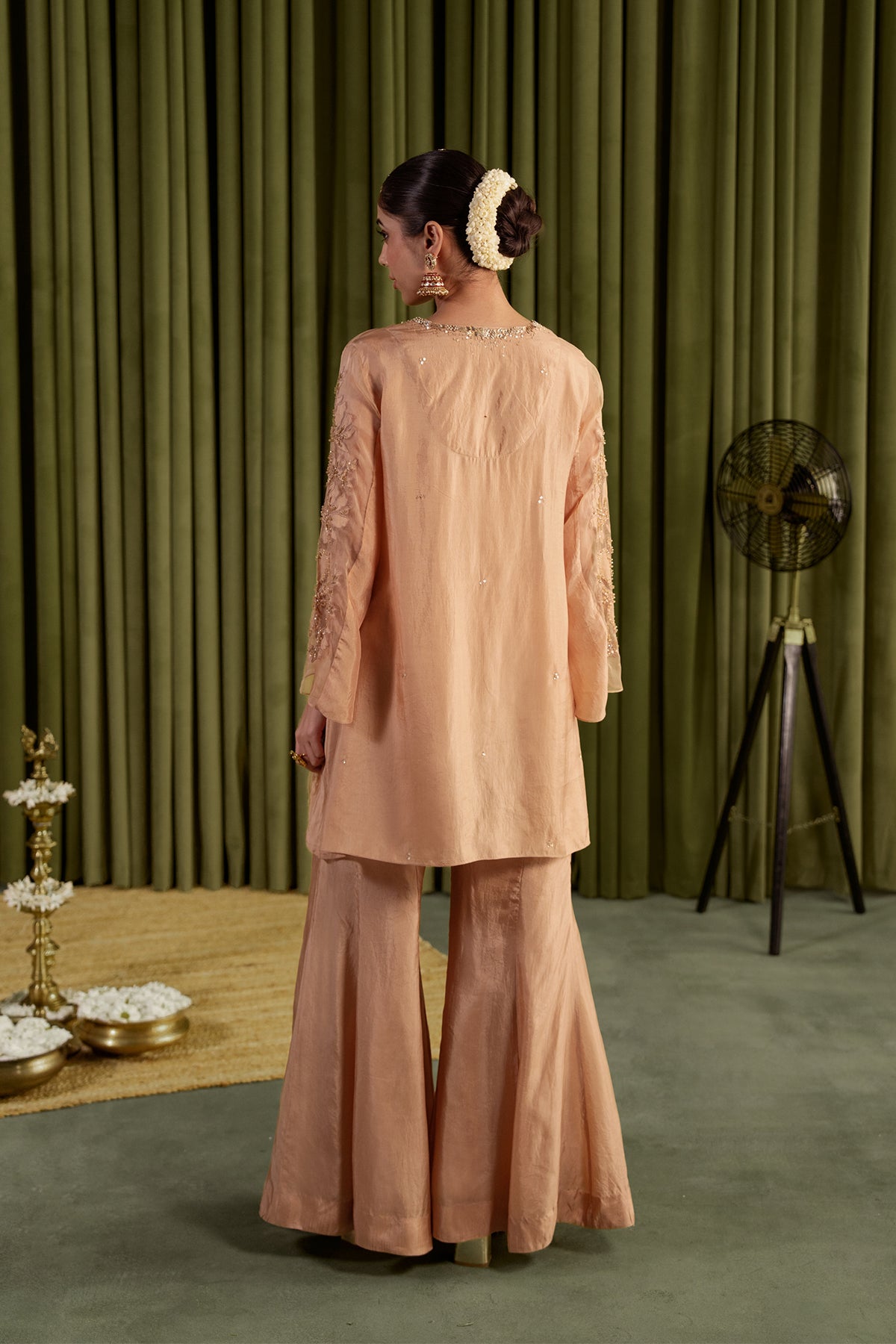 Golden beige sharara set with embroidered magnolia flower pattern.