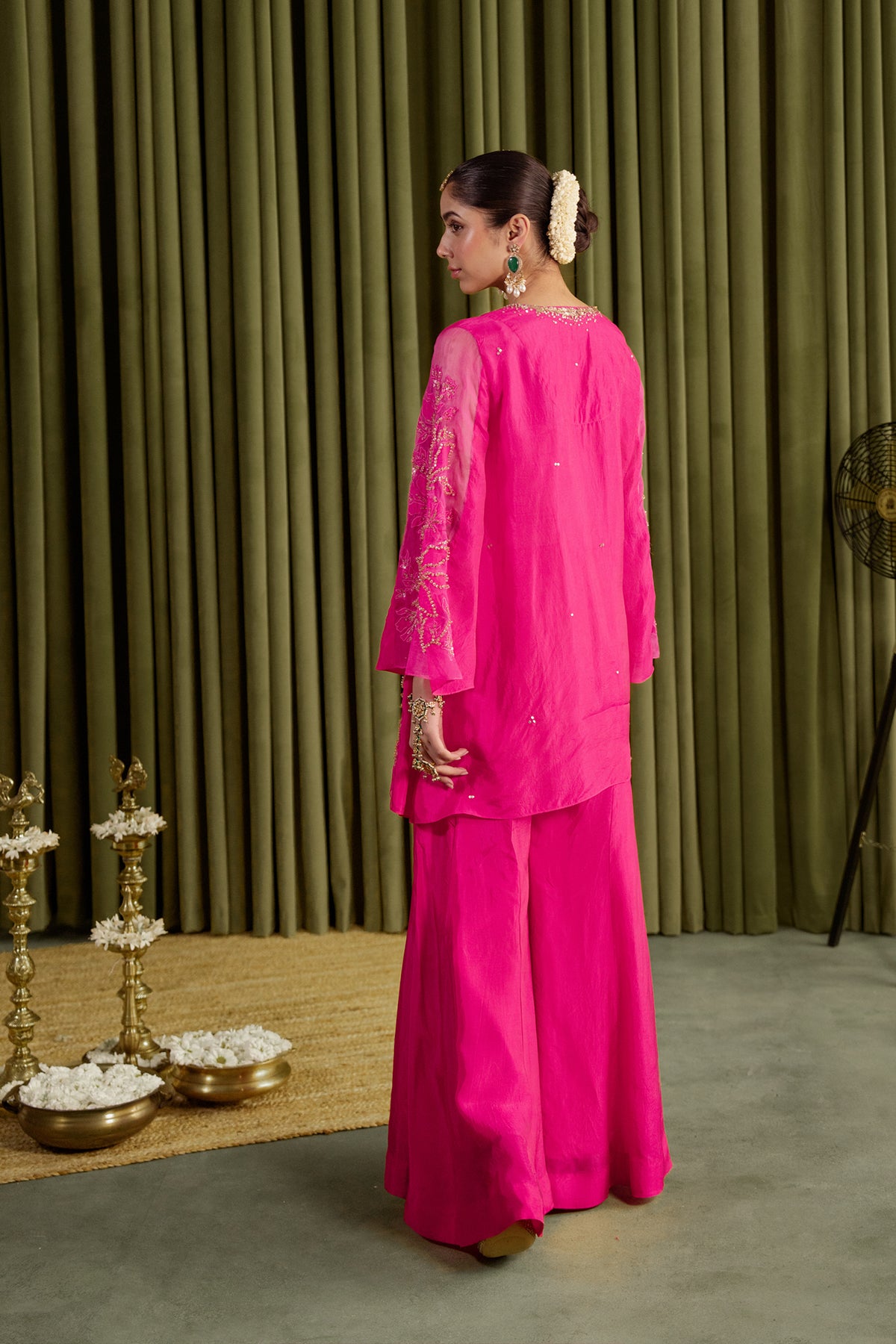Hot pink sharara set with embroidered magnolia flower pattern.