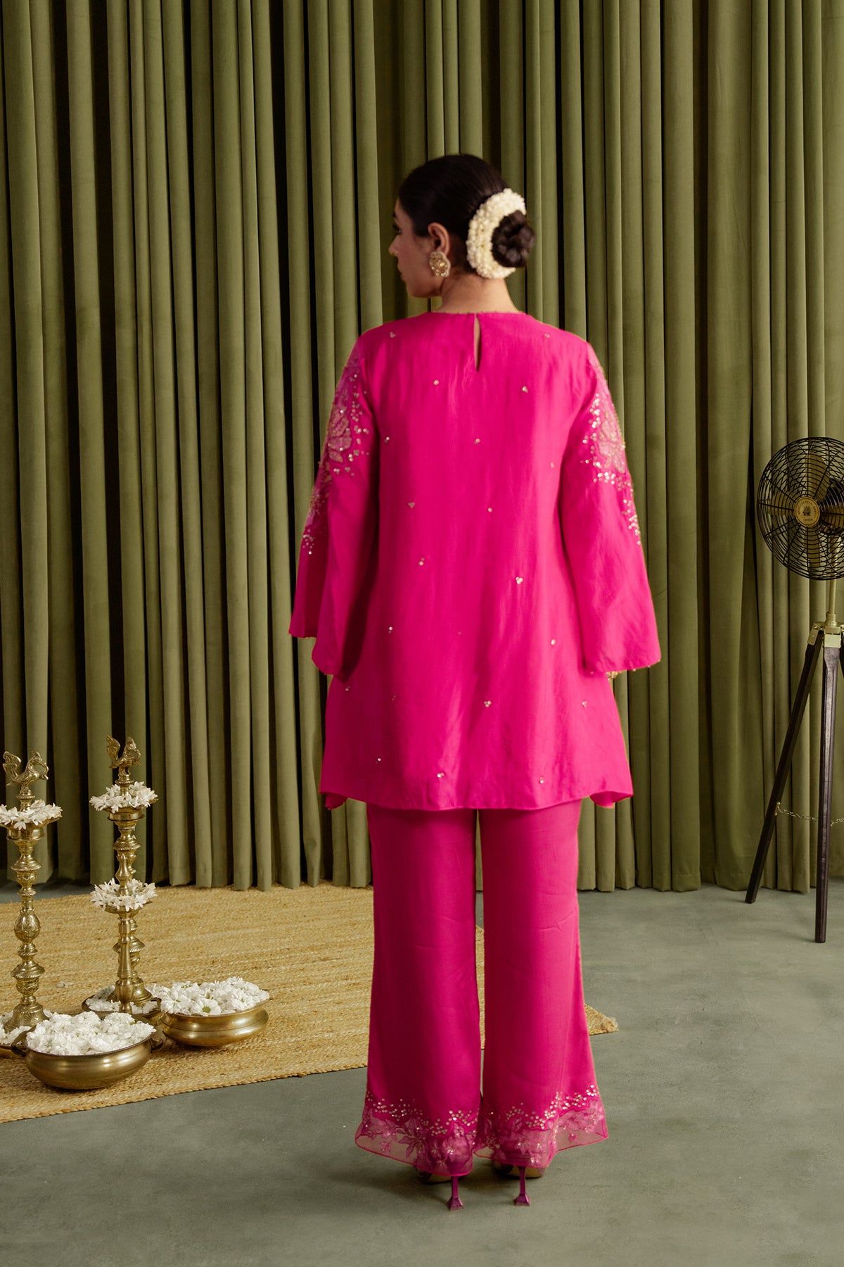 Hot pink co-ord set with embroidered magnolia flower pattern.