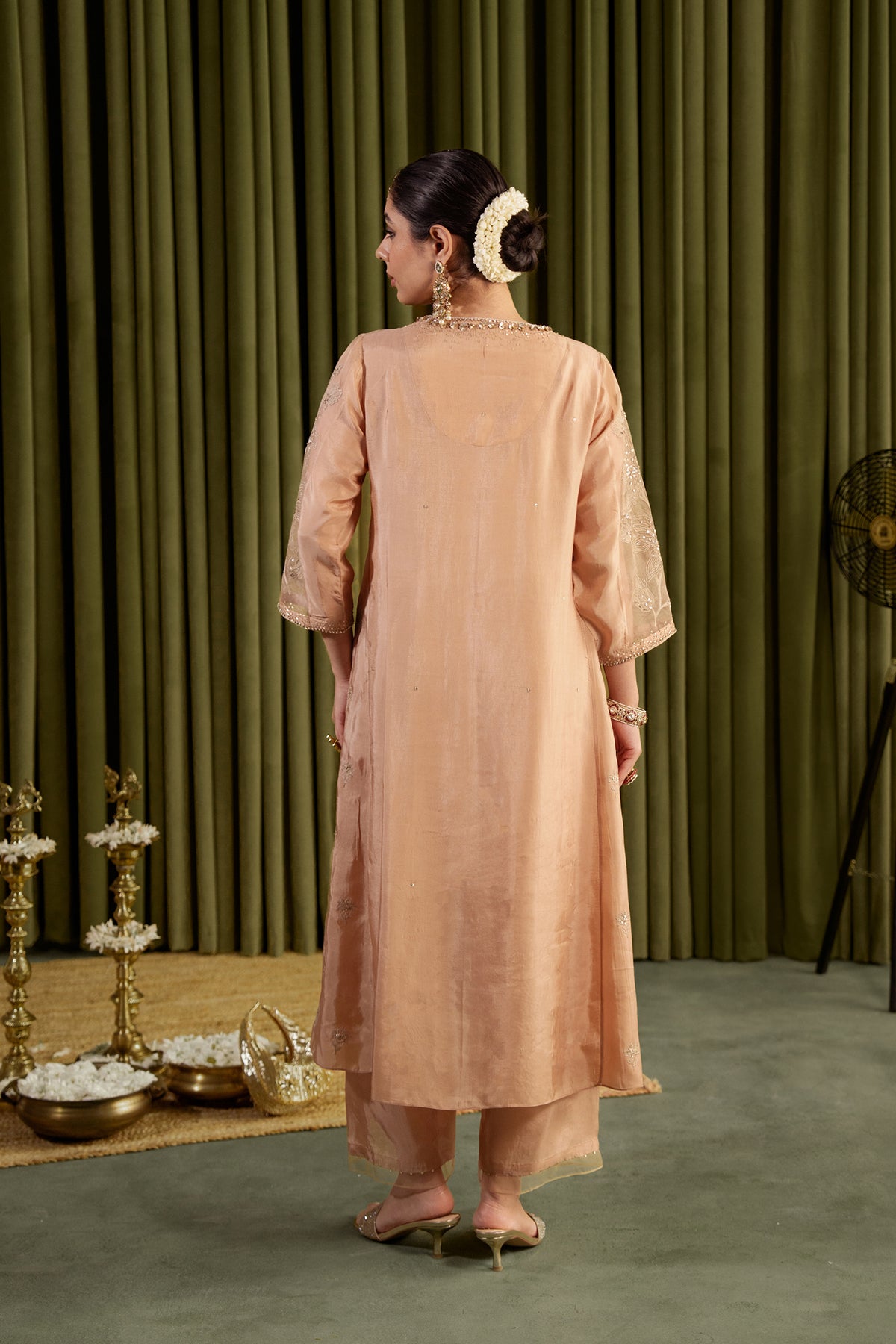 Golden beige kalidar kurta set with delicate floral embroidery.