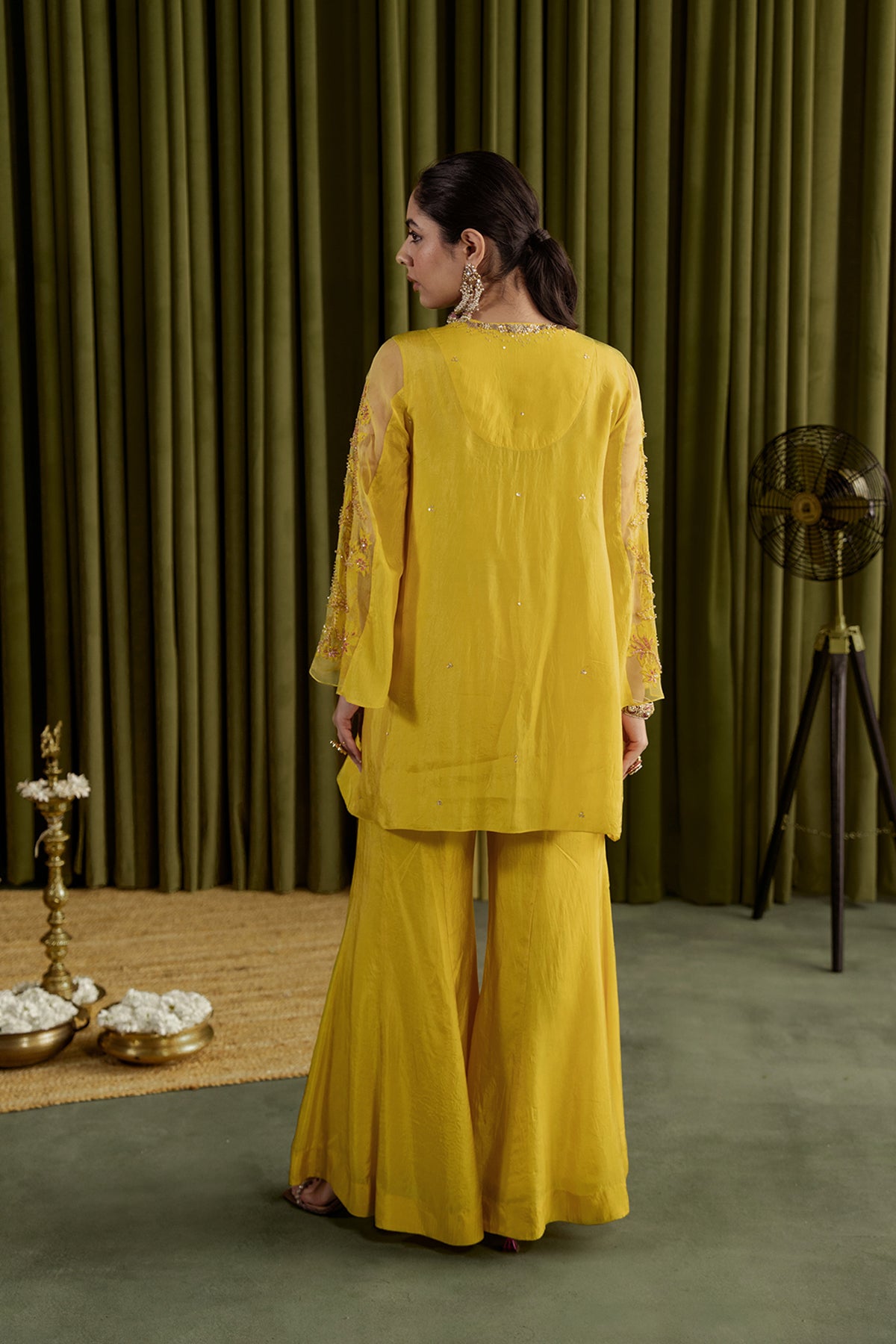 Mango sharara set with embroidered magnolia flower pattern.