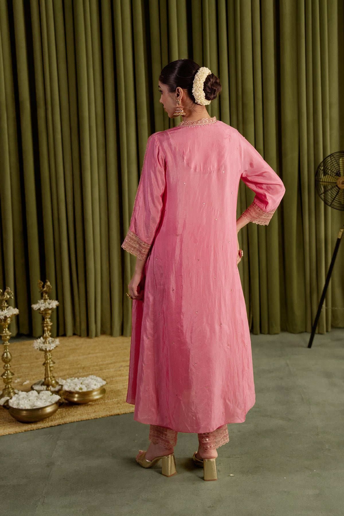 Rose pink kurta set in viscose silk base with embroidered magnolia flower pattern.