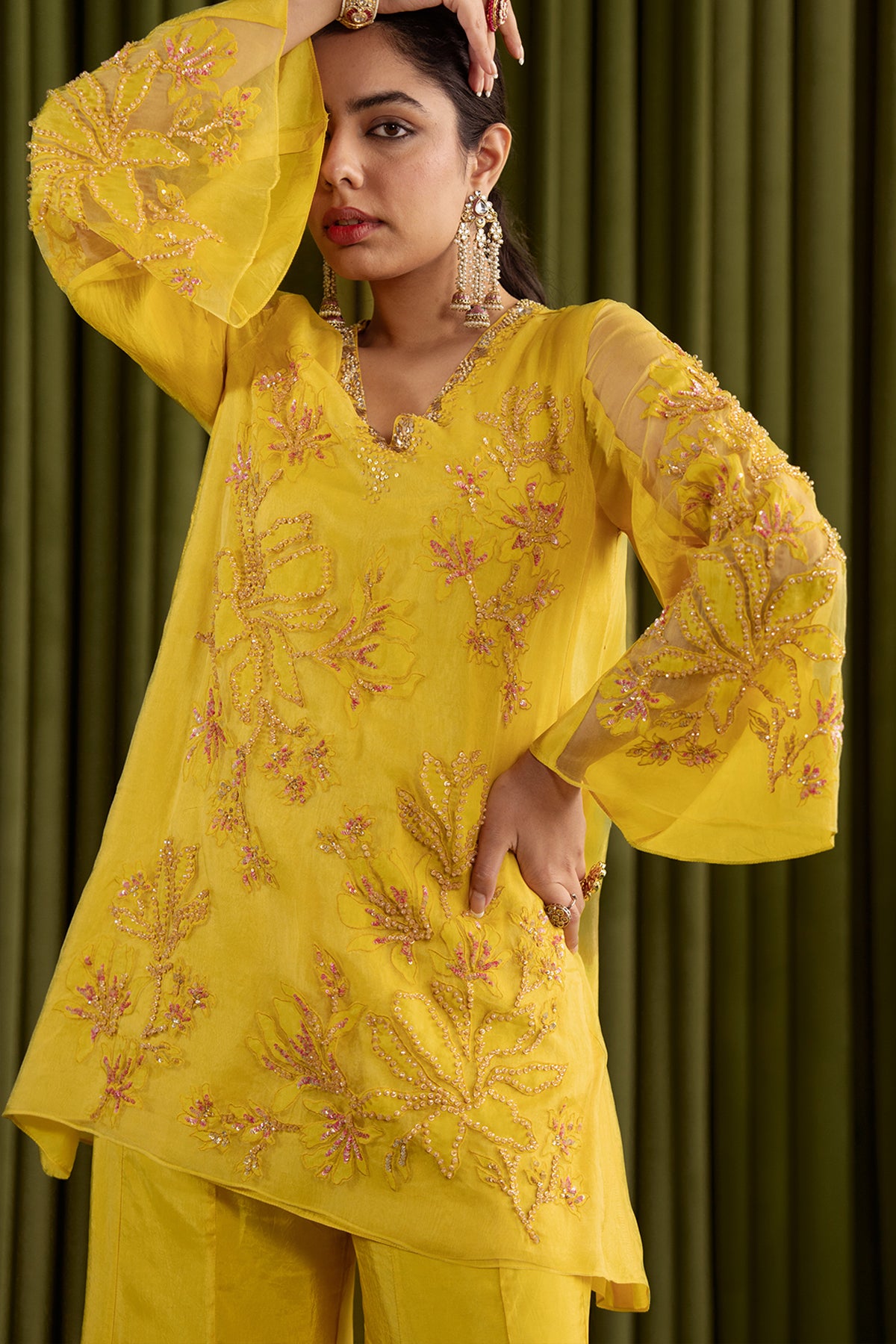 Mango sharara set with embroidered magnolia flower pattern.