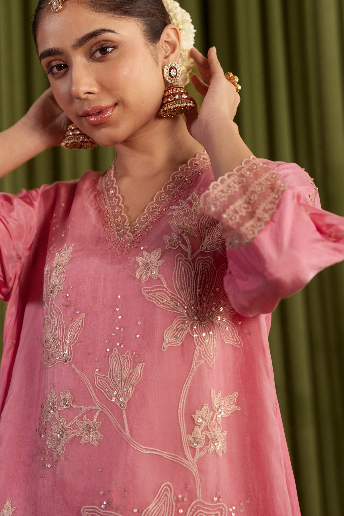 Rose pink kurta set with delicate floral embroidery.