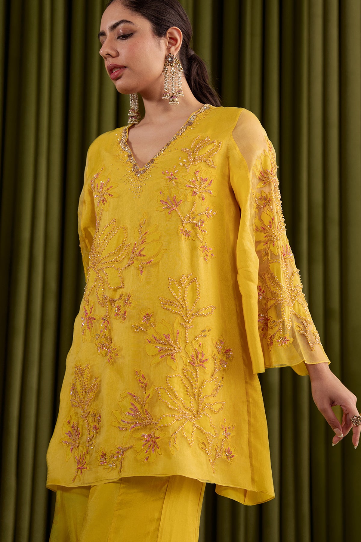 Mango sharara set with embroidered magnolia flower pattern.