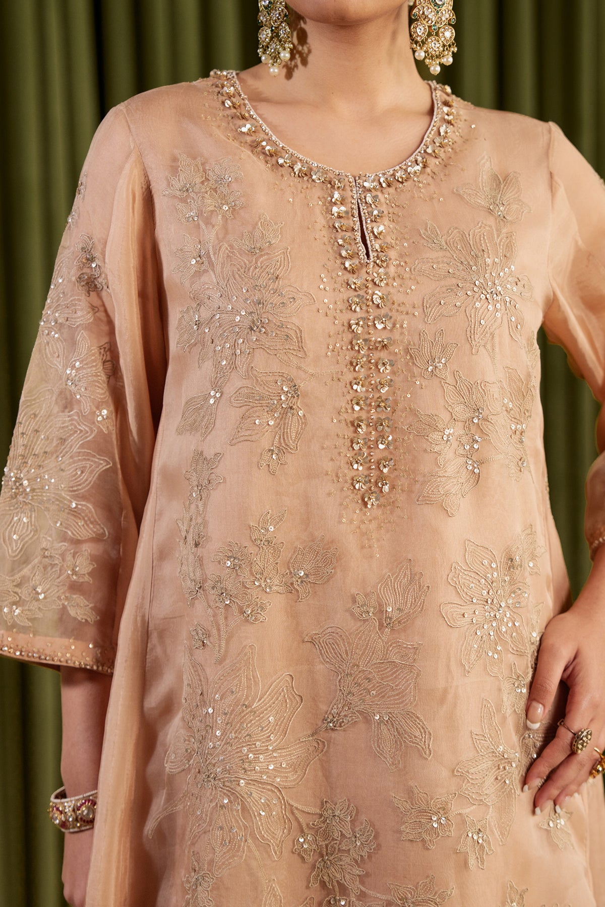 Golden beige kalidar kurta set with delicate floral embroidery.