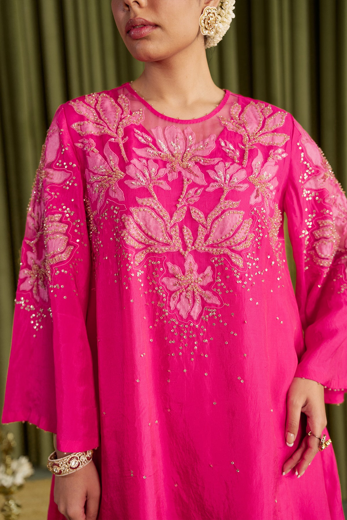 Hot pink co-ord set with embroidered magnolia flower pattern.