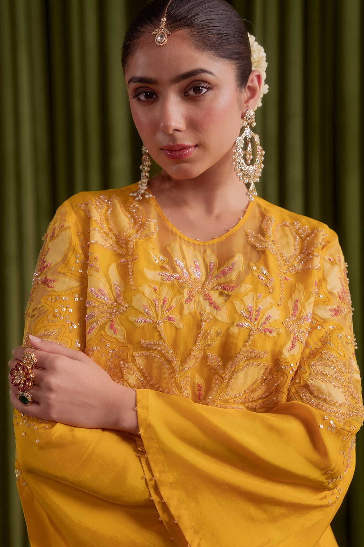 Golden yellow co-ord set with embroidered magnolia flower pattern.