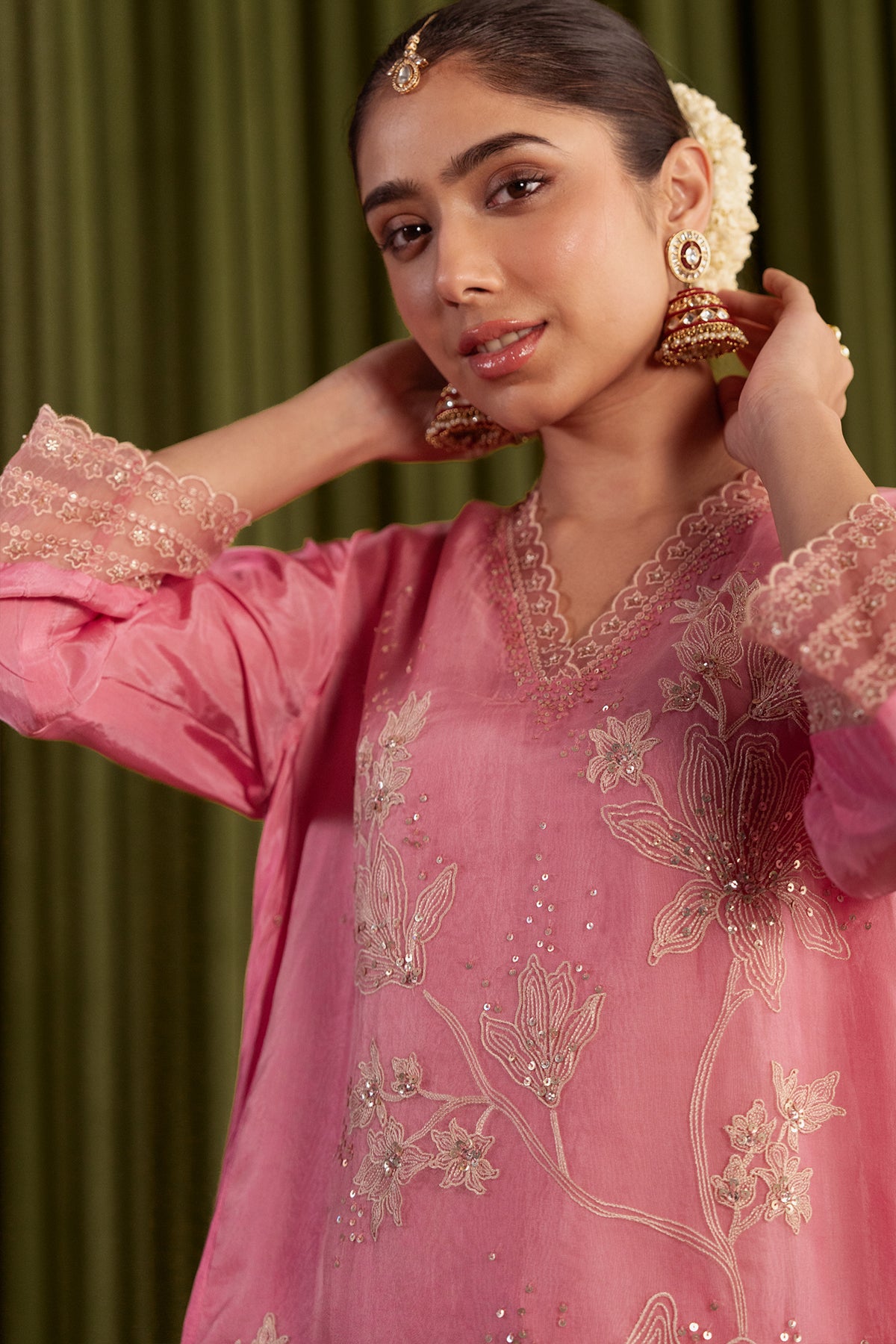 Rose pink kurta set with delicate floral embroidery.