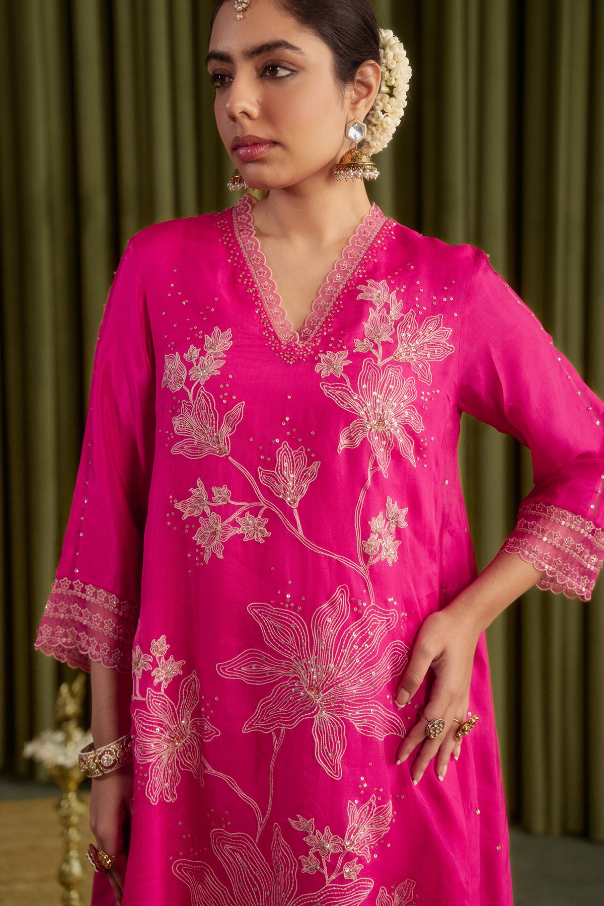 Hot pink kurta set with delicate floral embroidery.