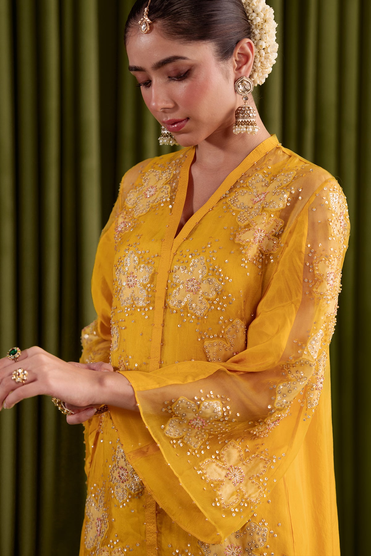 Golden beige co-ord set with embroidered floral pattern.