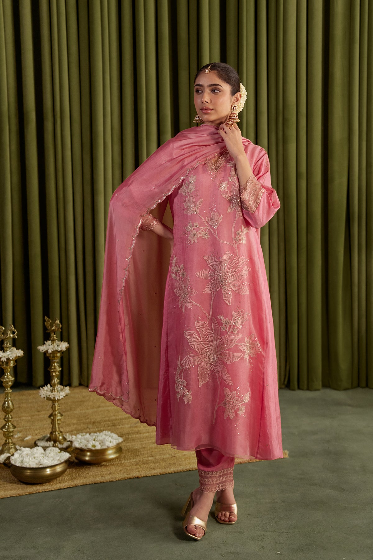 Rose pink kurta set with delicate floral embroidery.