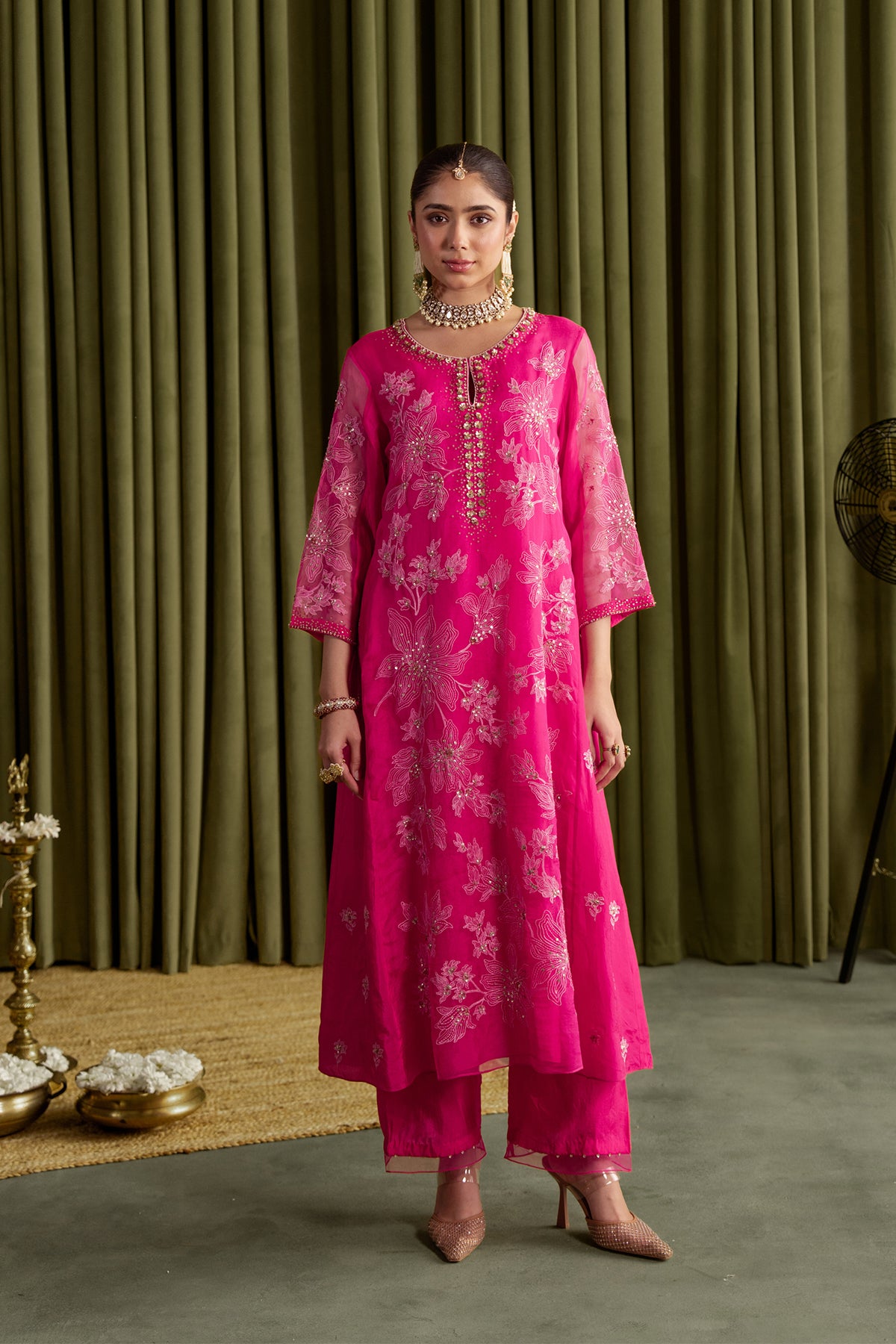 Hot pink kalidar kurta set with delicate floral embroidery.