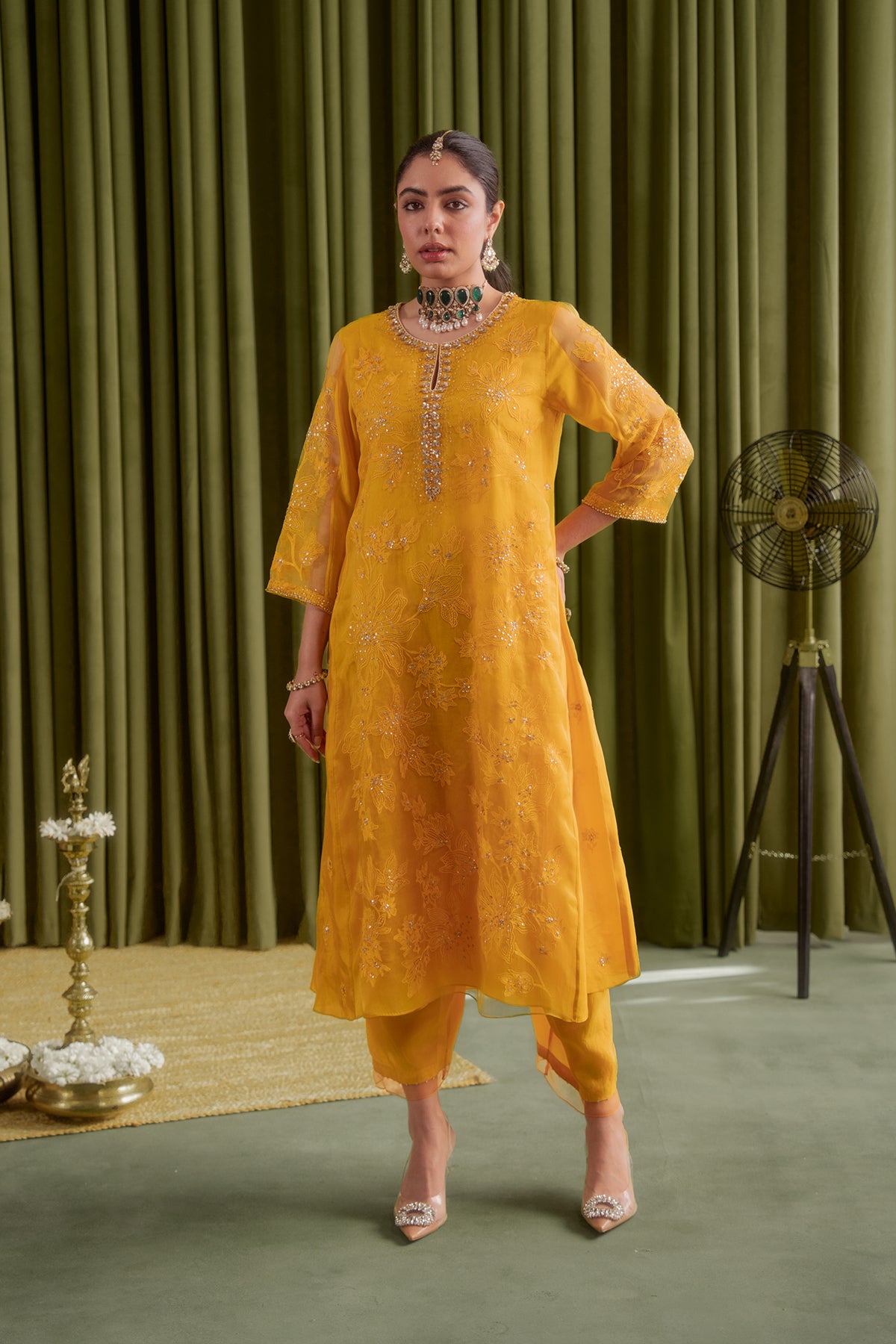 Golden yellow kalidar kurta set with delicate floral embroidery.