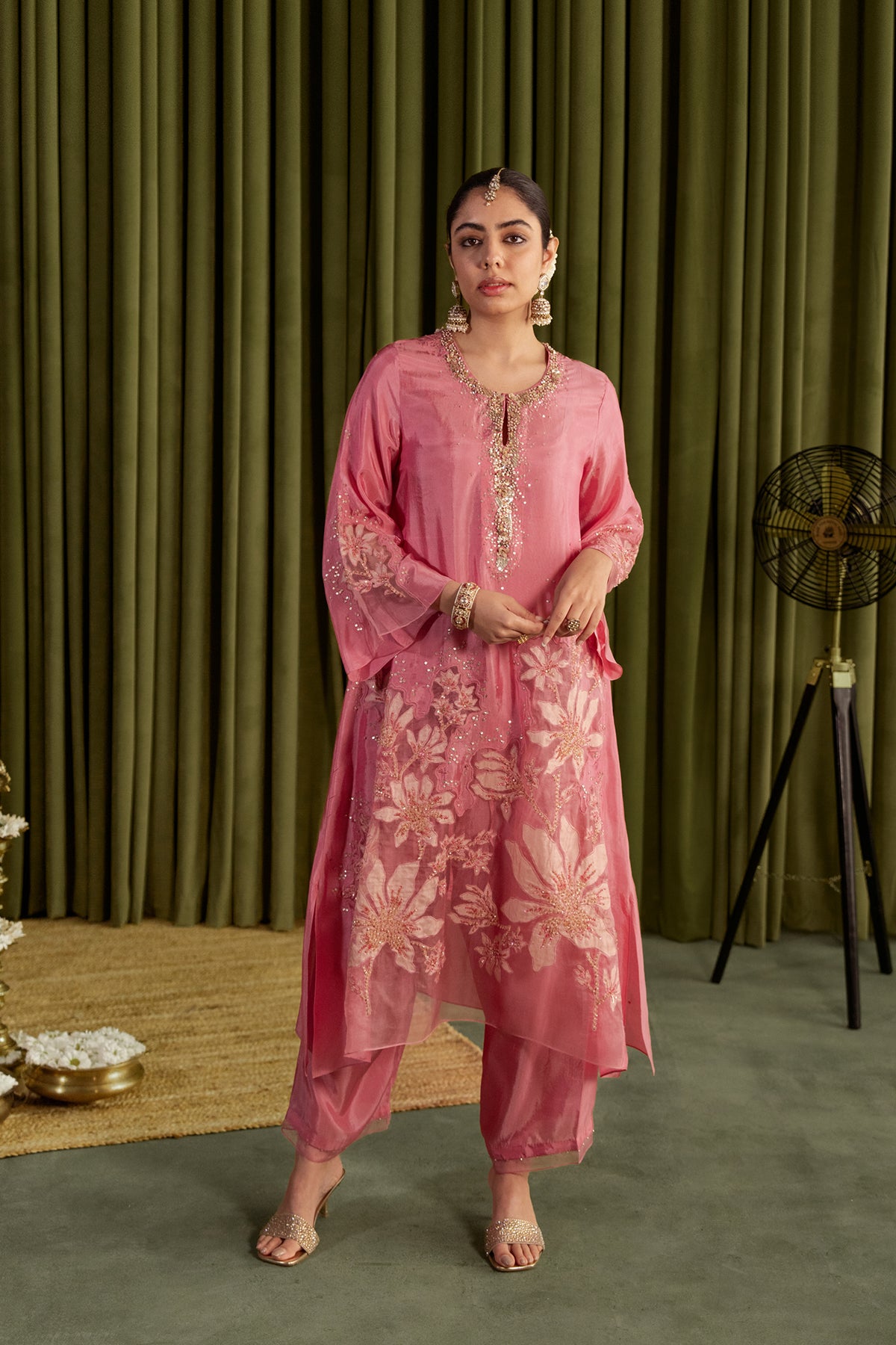 Rose pink kurta set in viscose silk base with embroidered magnolia flower pattern.