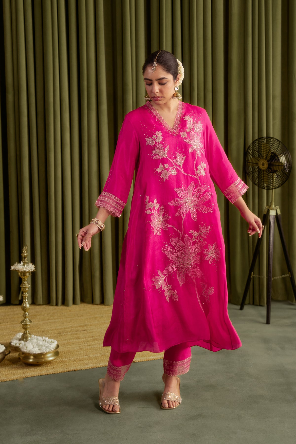 Hot pink kurta set with delicate floral embroidery.