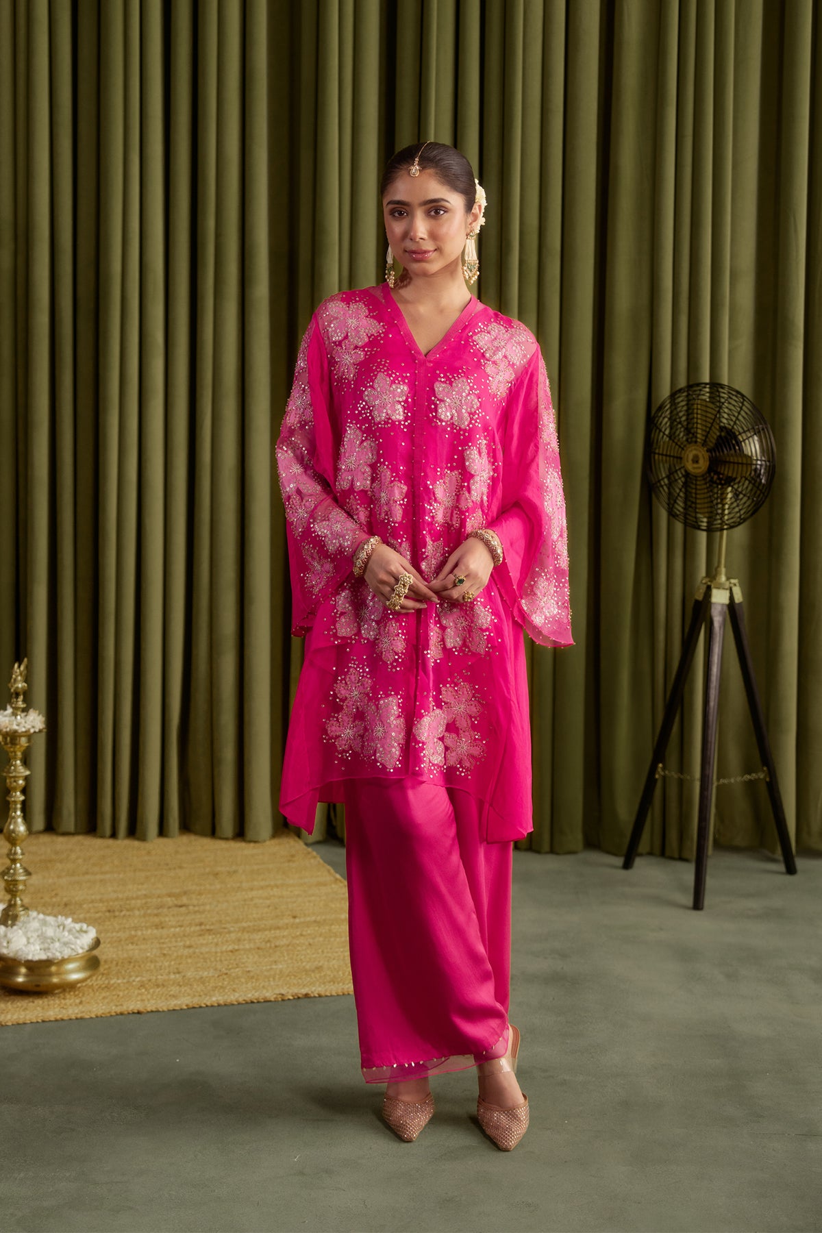 Hot pink co-ord set with embroidered floral pattern.