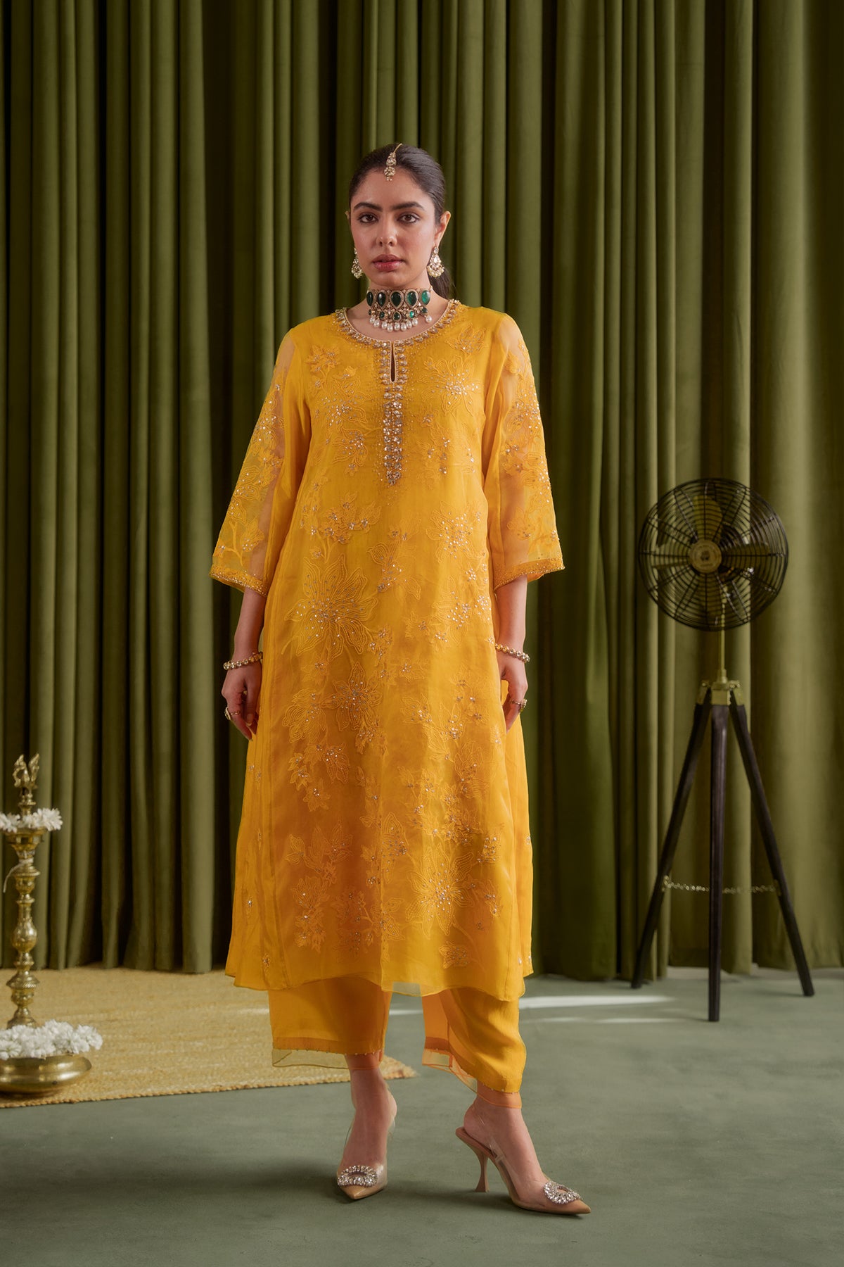 Golden yellow kalidar kurta set with delicate floral embroidery.