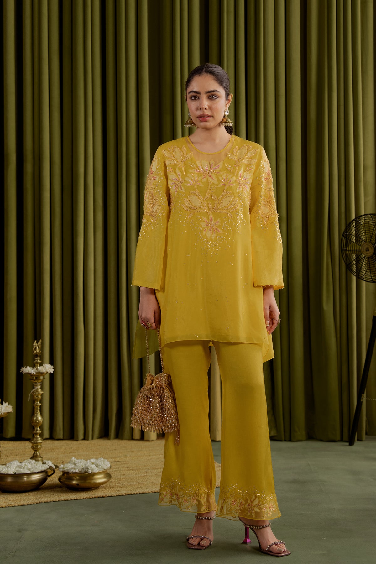 Mango co-ord set with embroidered magnolia flower pattern.