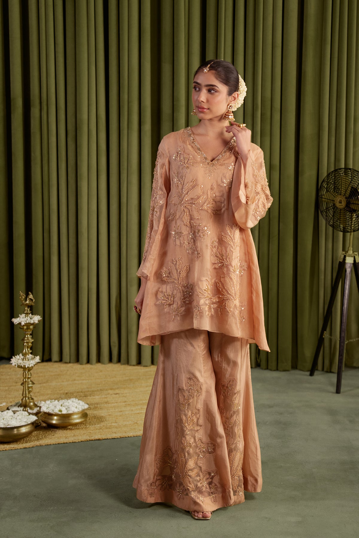 Golden beige sharara set with embroidered magnolia flower pattern.
