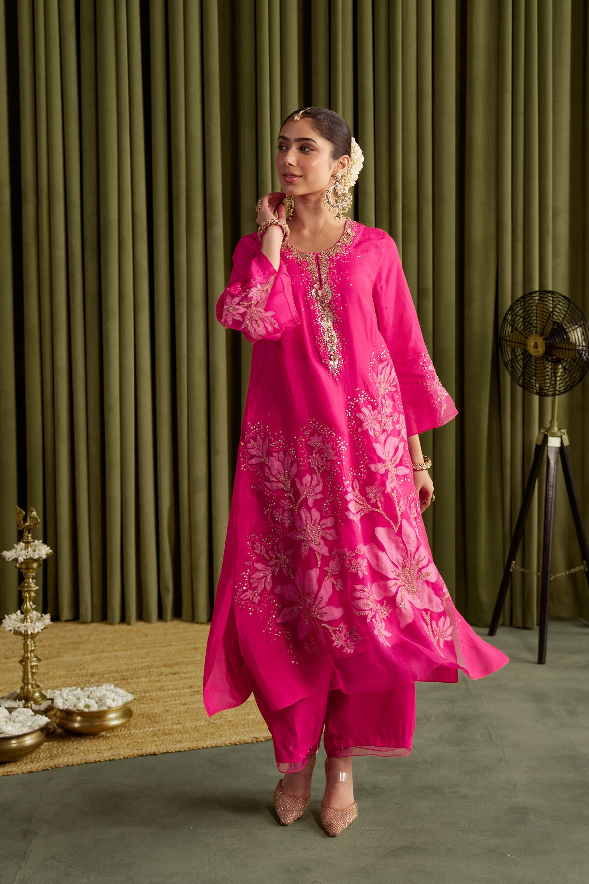 Hot pink kurta set in viscose silk base with embroidered magnolia flower pattern.