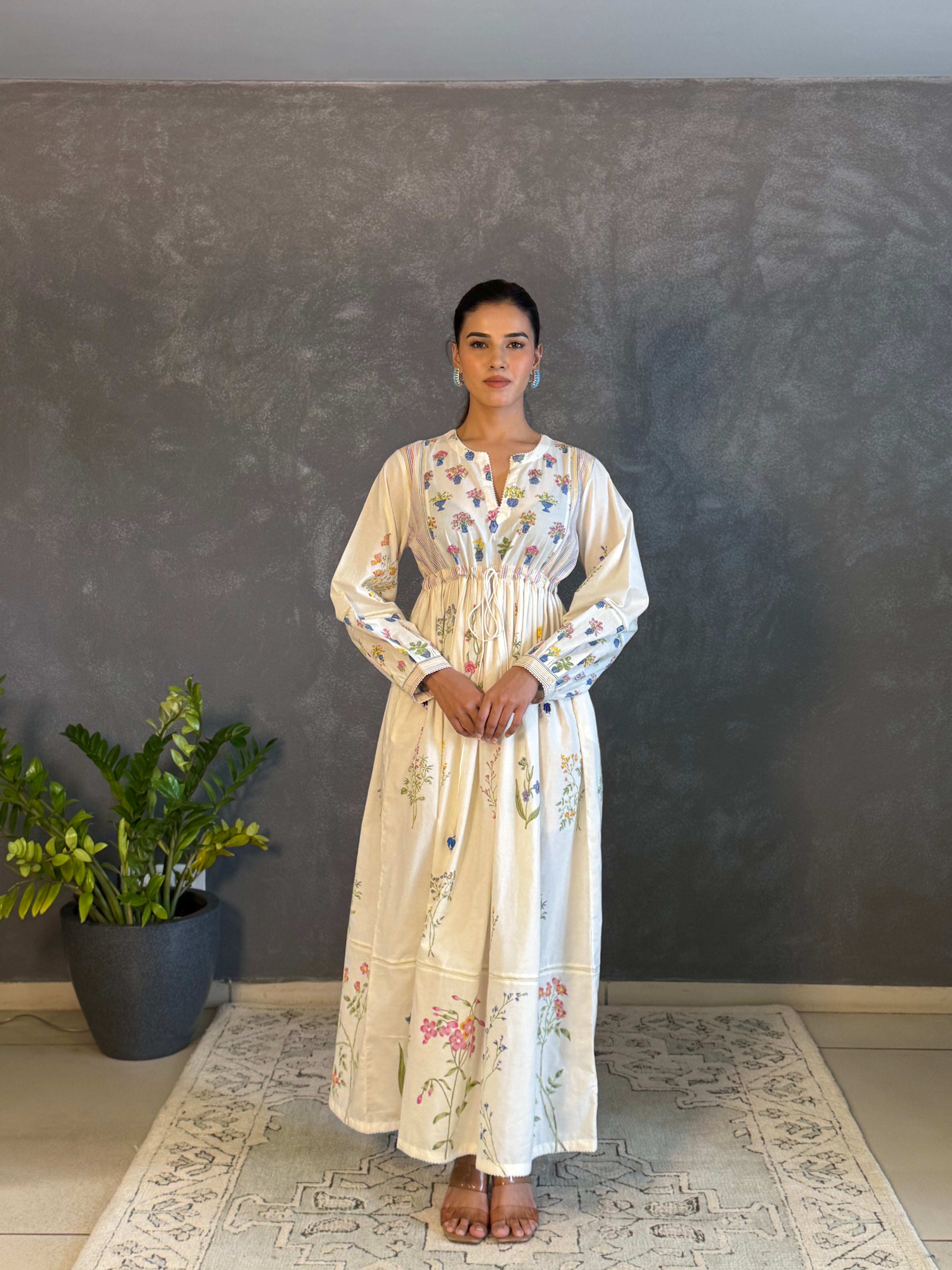 Off white hand block printed long dress with all-over multi coloured flower and small floral booti at the yoke.