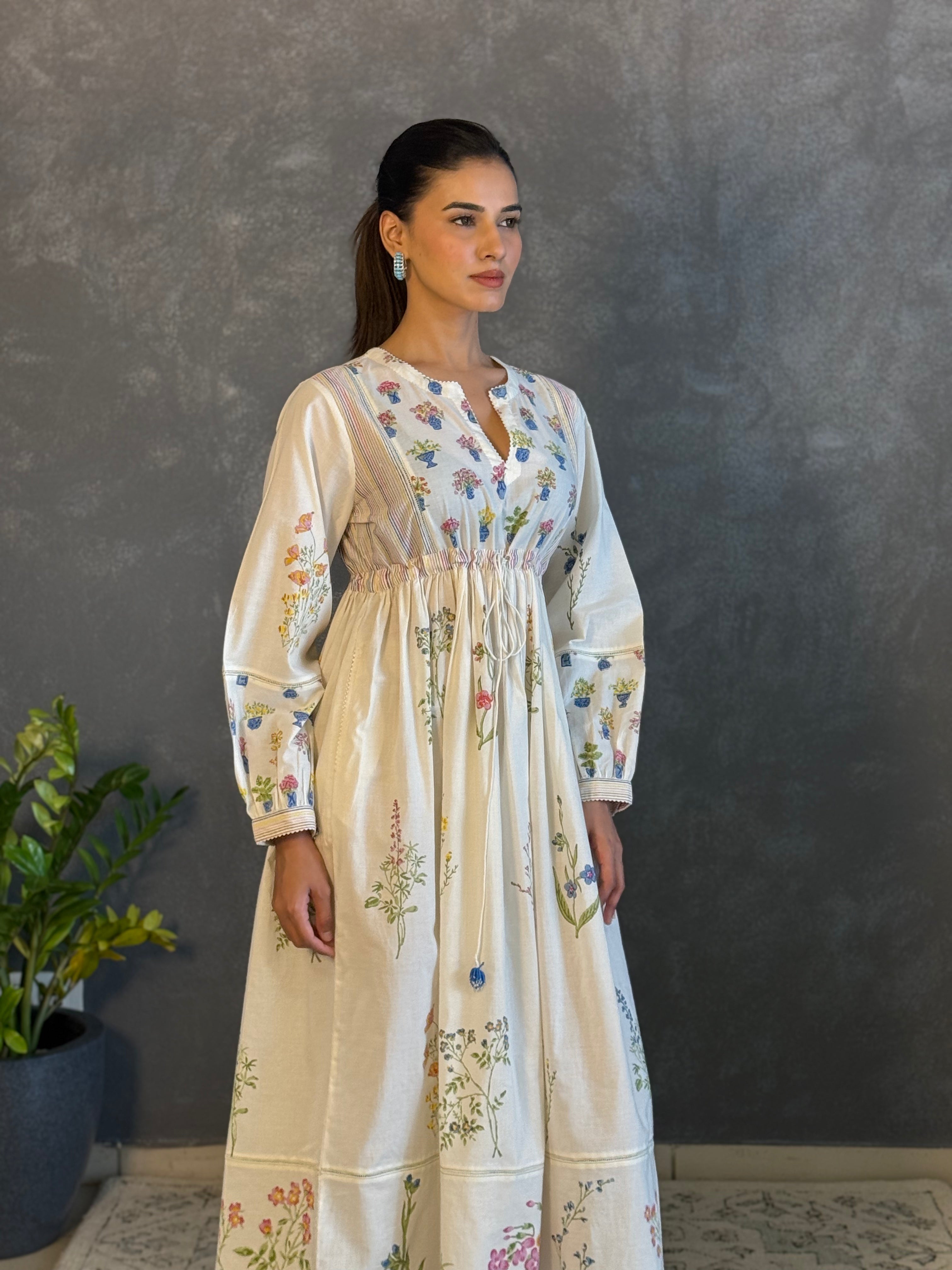 Off white hand block printed long dress with all-over multi coloured flower and small floral booti at the yoke.