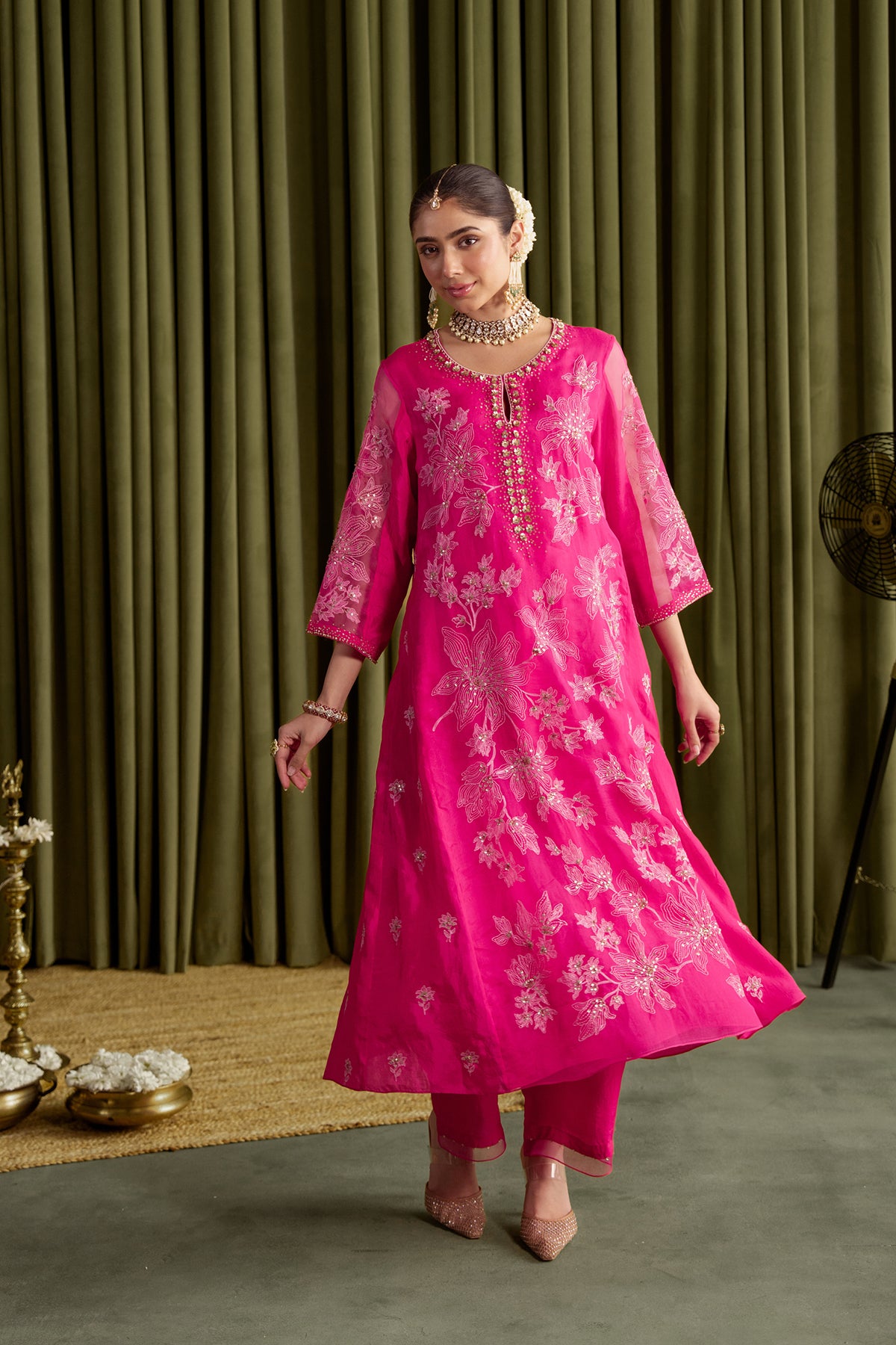 Hot pink kalidar kurta set with delicate floral embroidery.