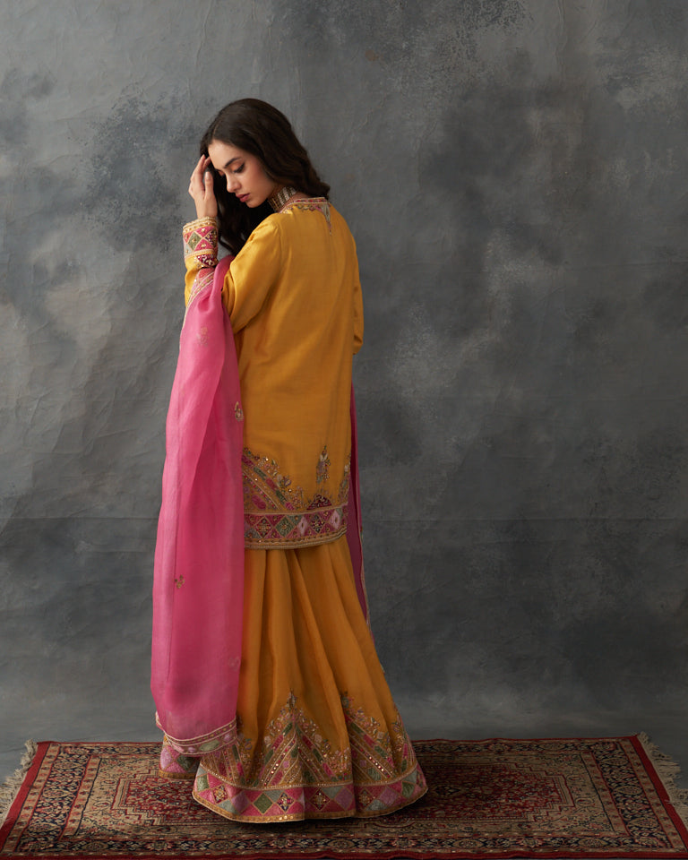 Velvet patchwork short kurta with Sharara pants & dupatta.