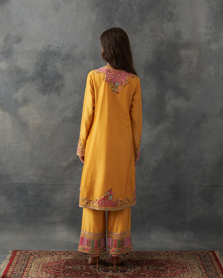 Velvet patchwork Knee length yellow kurta with pants & organza dupatta.