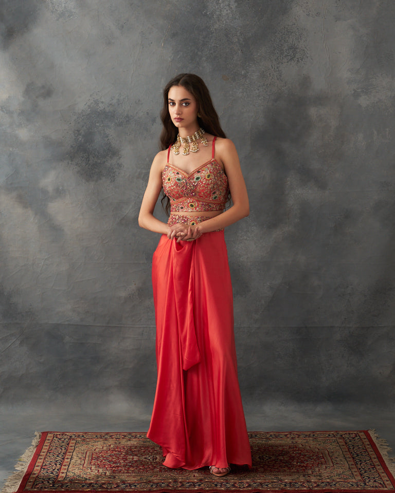 Gulrez cape with embroidered bustier & draped skirt.