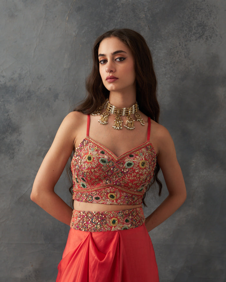 Gulrez cape with embroidered bustier & draped skirt.