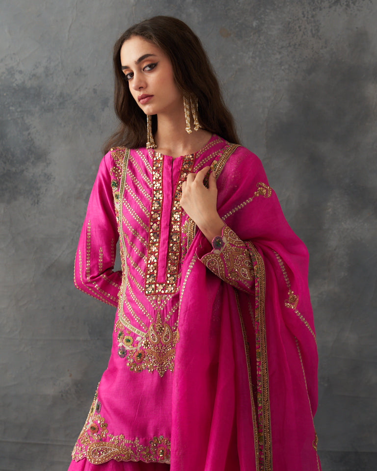 Gulrez short kurti with sharara & dupatta.