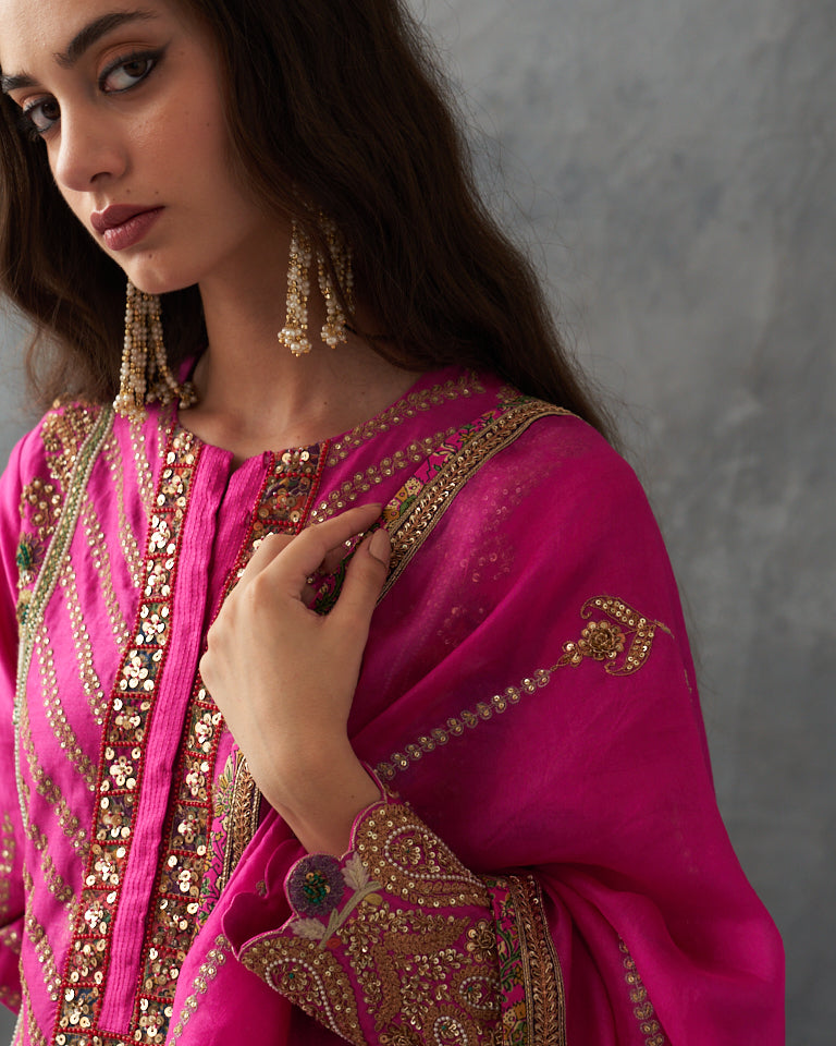 Gulrez short kurti with sharara & dupatta.