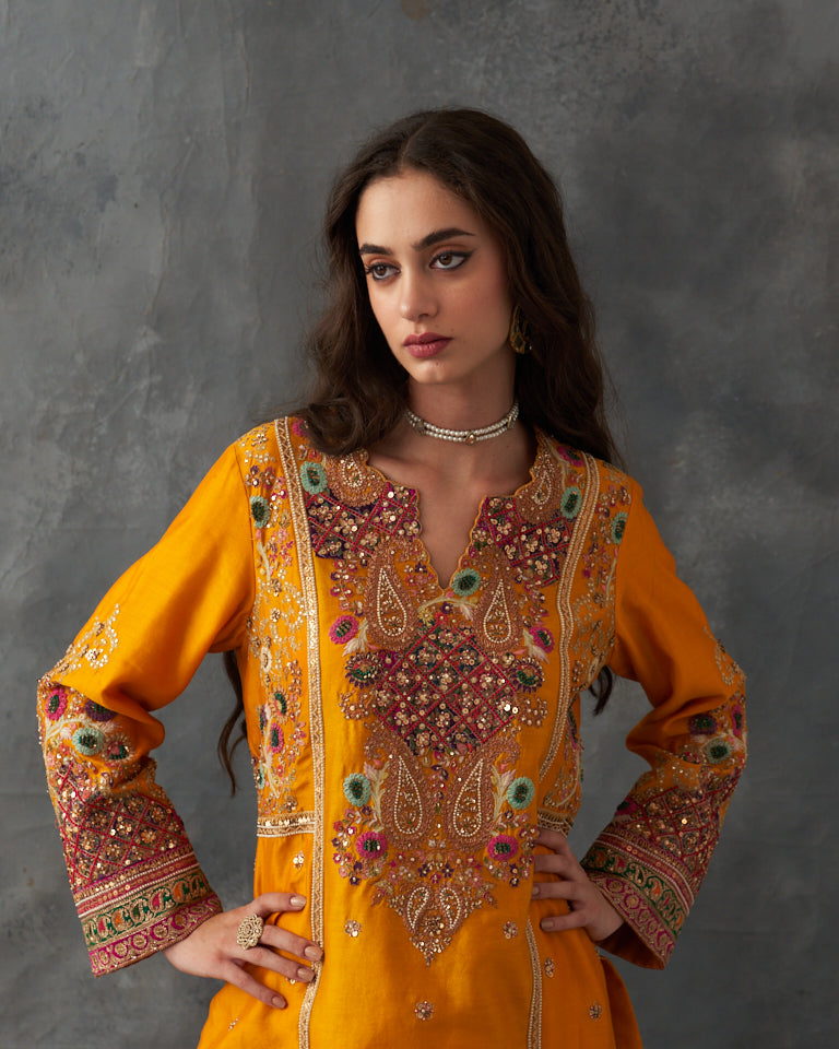 Gulrez short kurti with straight cut pants.