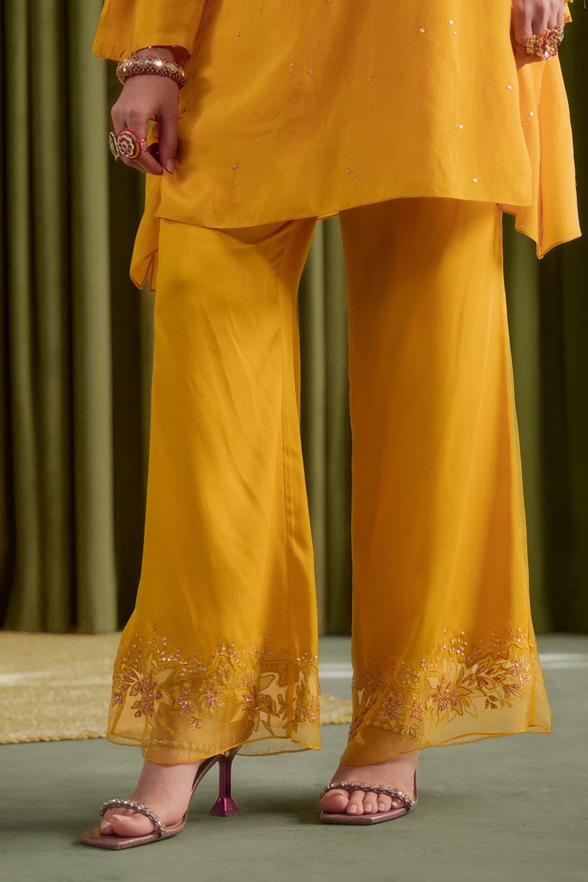 Golden yellow co-ord set with embroidered magnolia flower pattern.