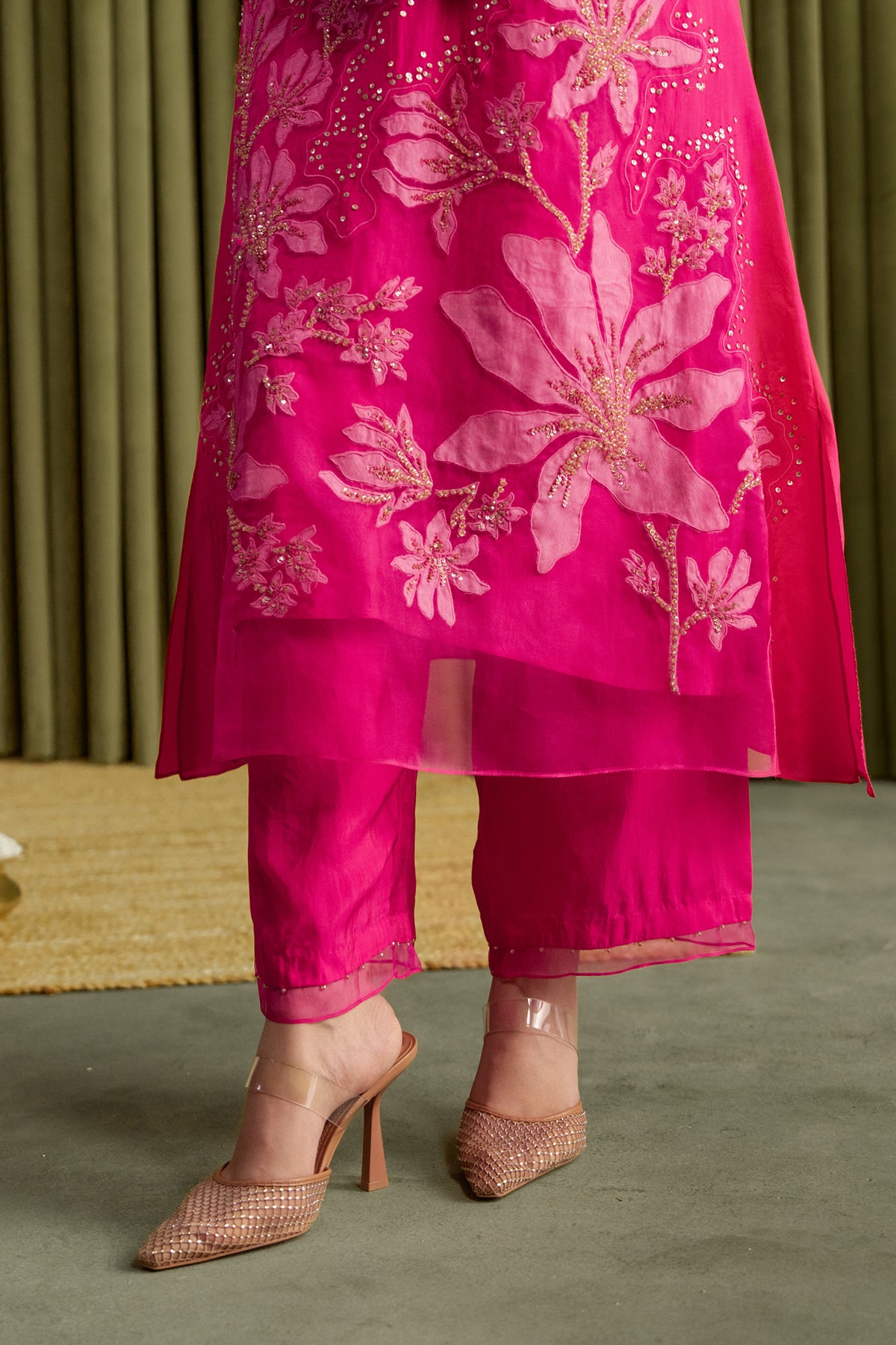 Hot pink kurta set in viscose silk base with embroidered magnolia flower pattern.