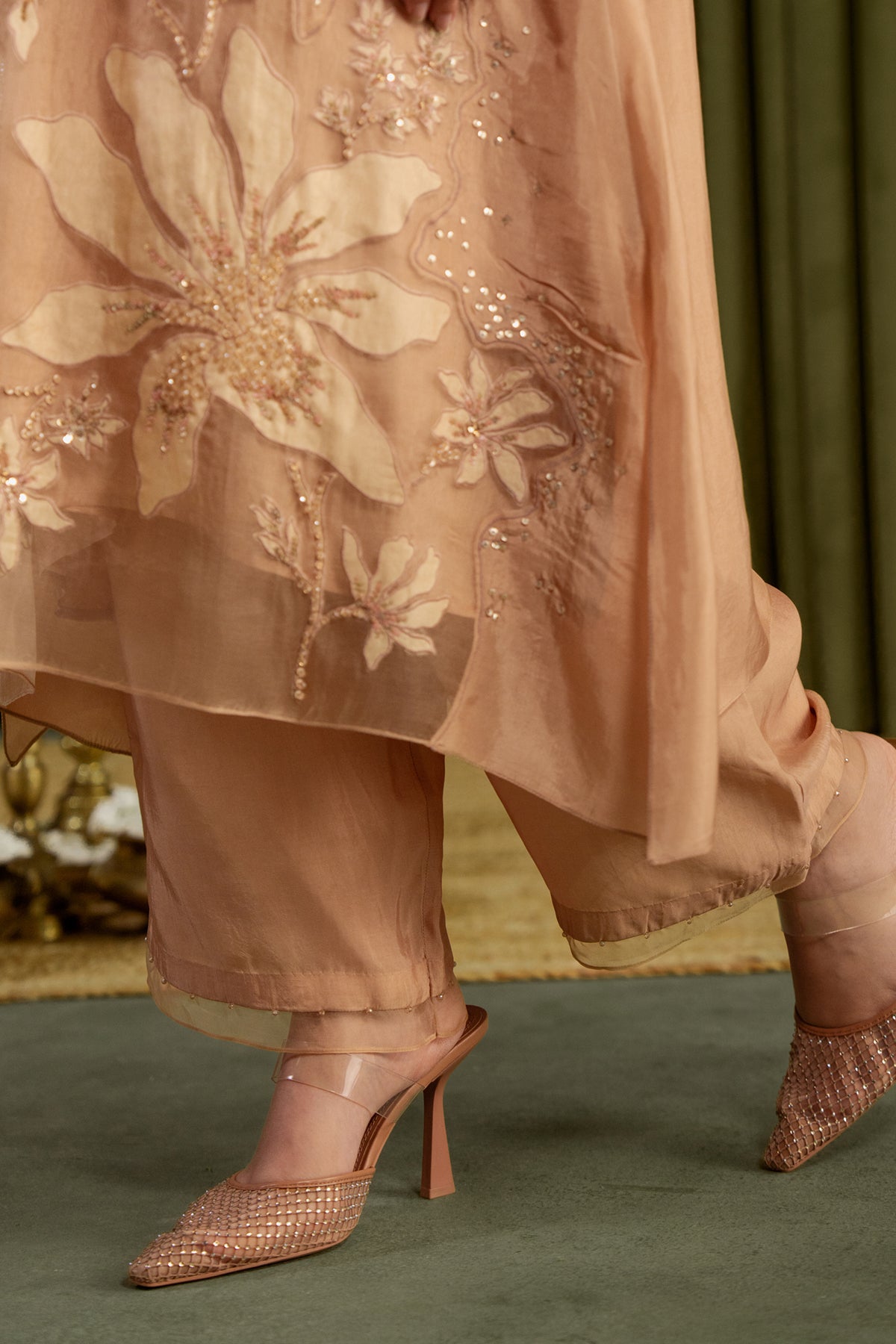 Golden beige kurta set in viscose silk base with embroidered magnolia flower pattern.