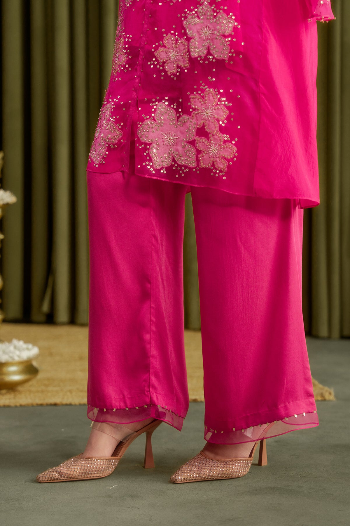 Hot pink co-ord set with embroidered floral pattern.