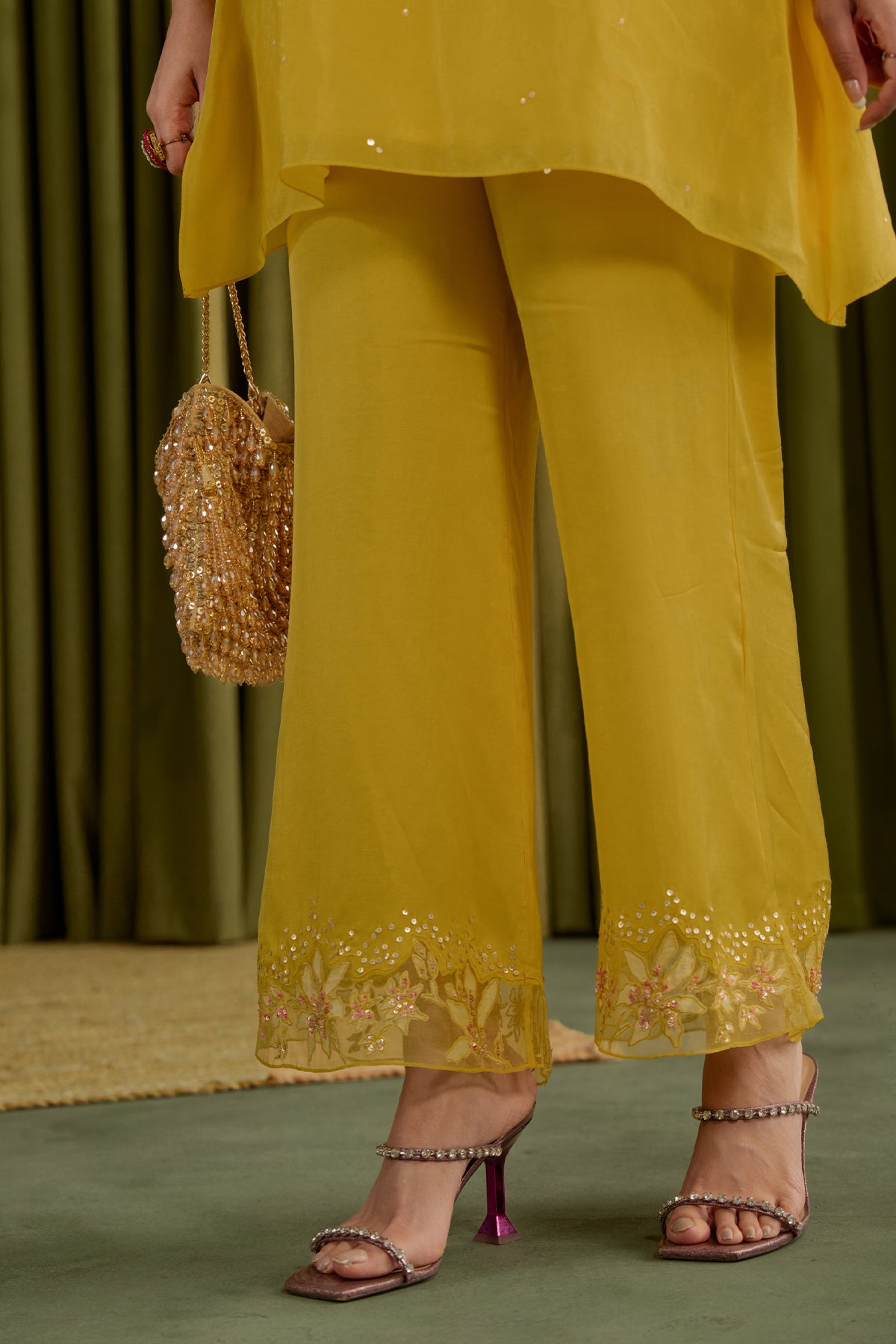 Mango co-ord set with embroidered magnolia flower pattern.