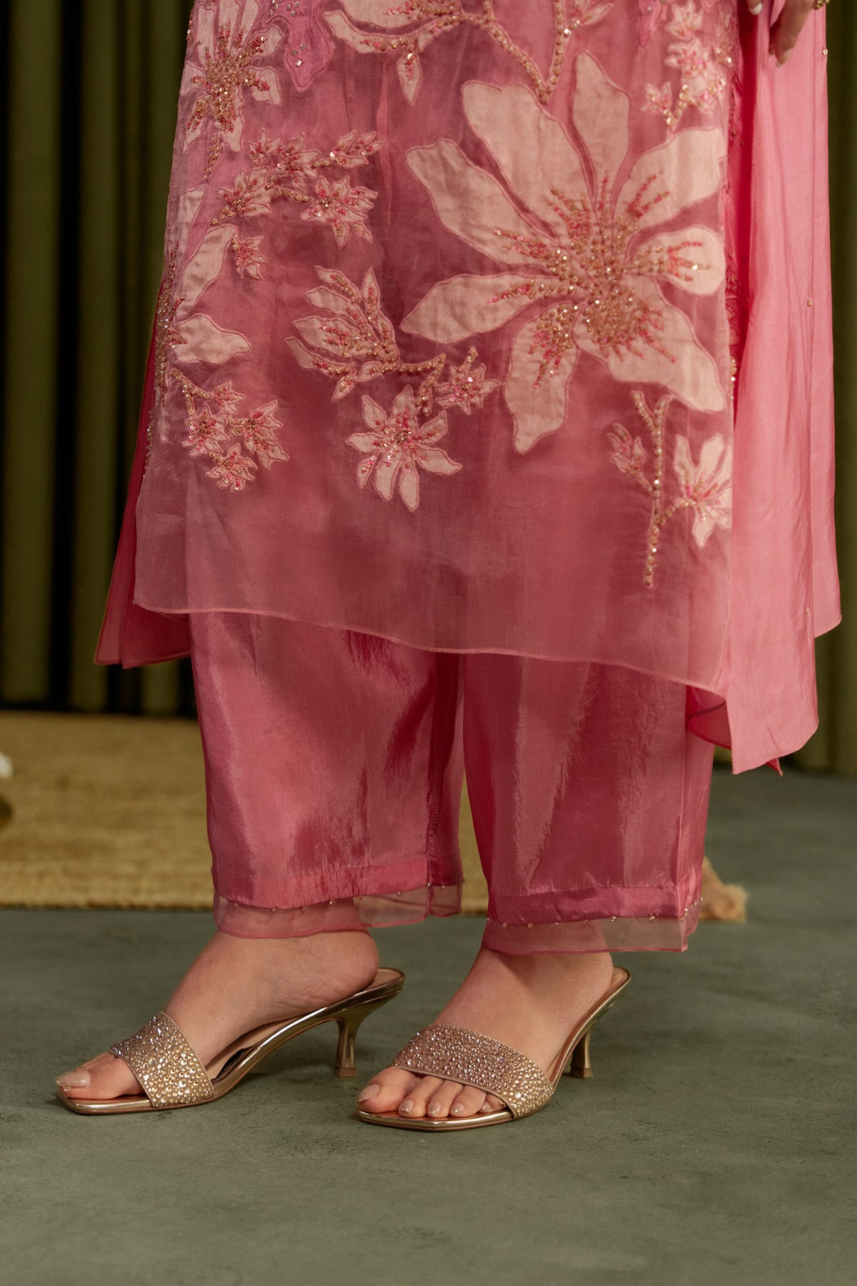 Rose pink kurta set in viscose silk base with embroidered magnolia flower pattern.