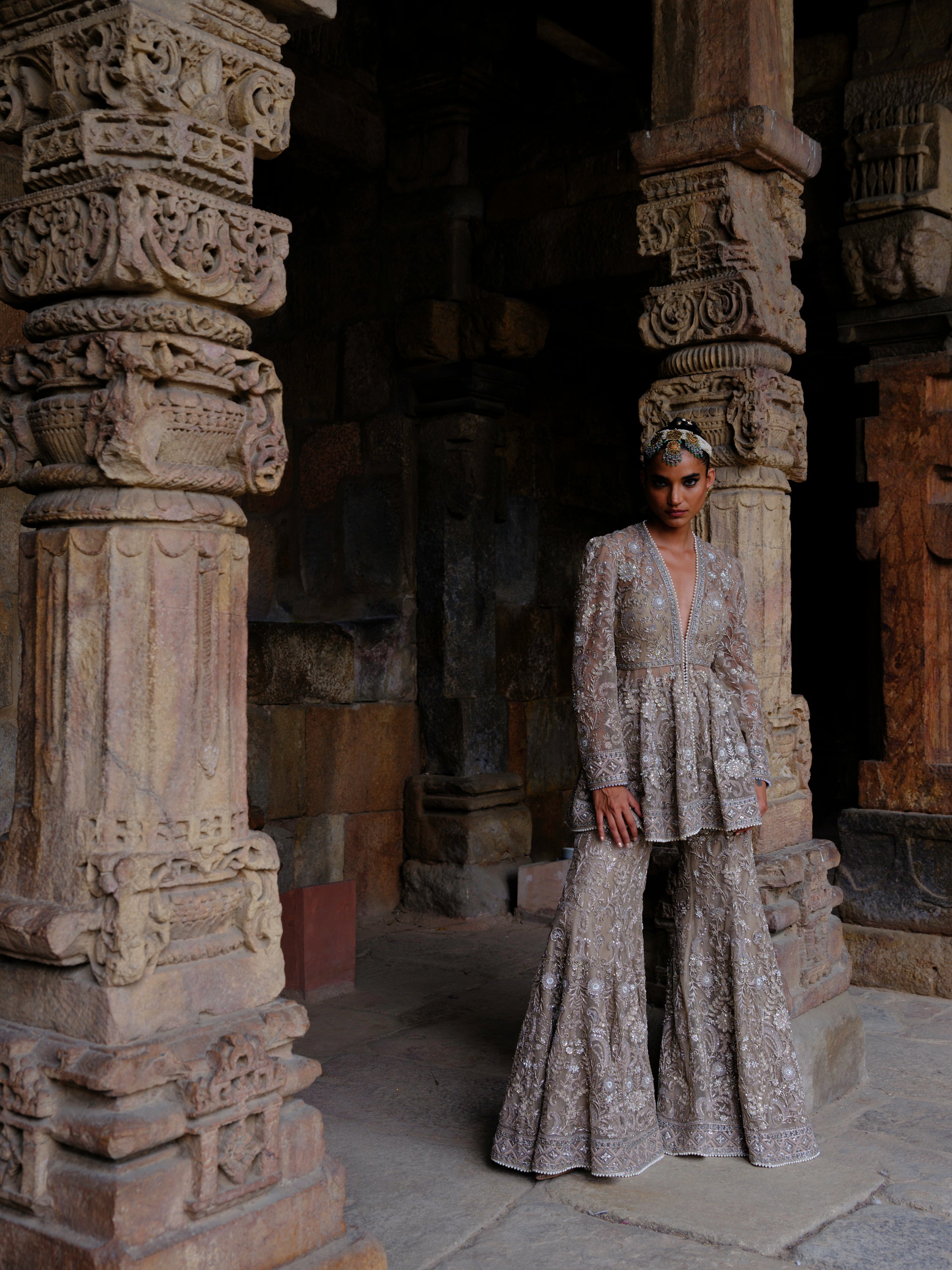 Featuring a peplum in net base with zari embroidery