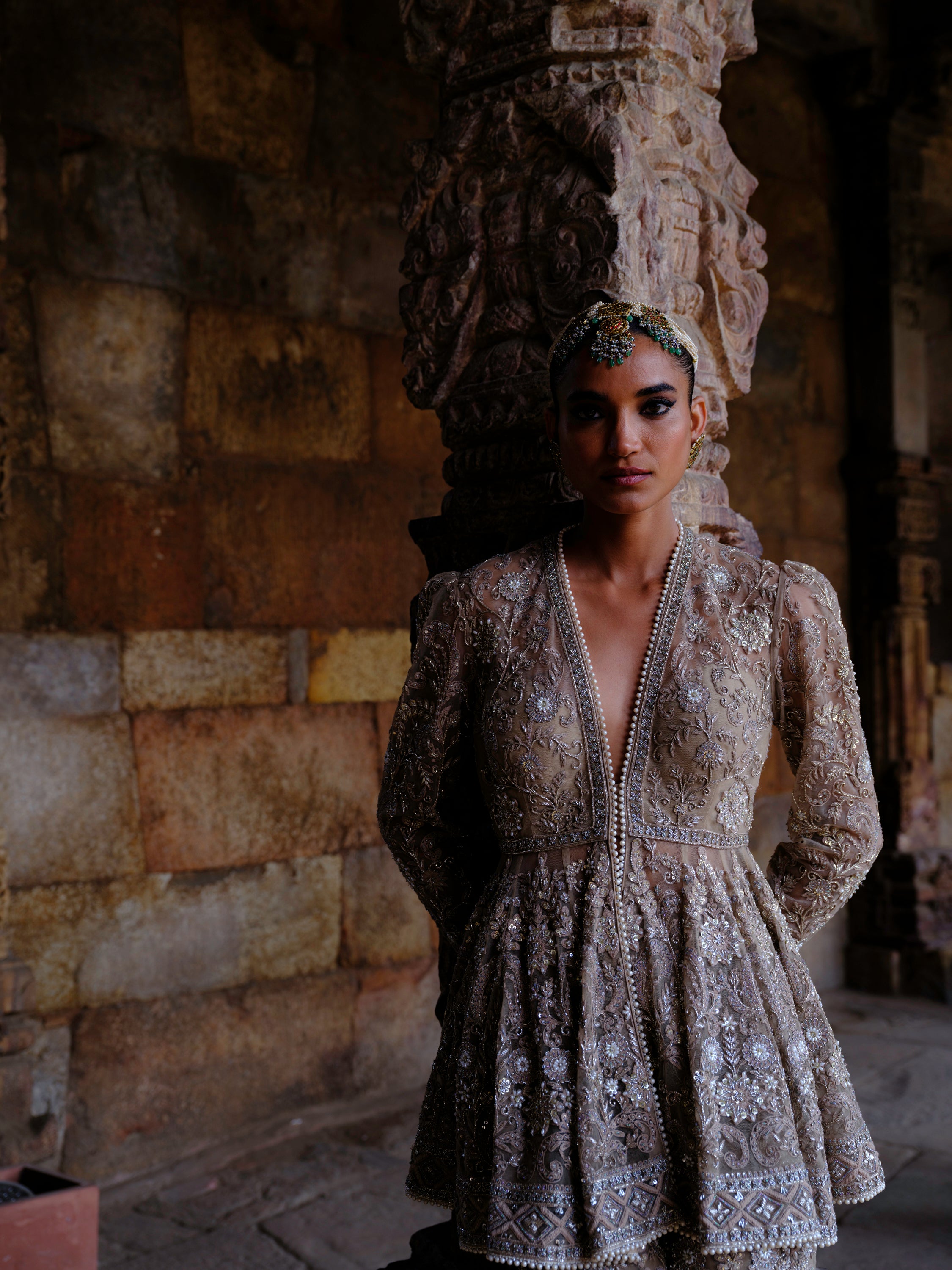 Featuring a peplum in net base with zari embroidery