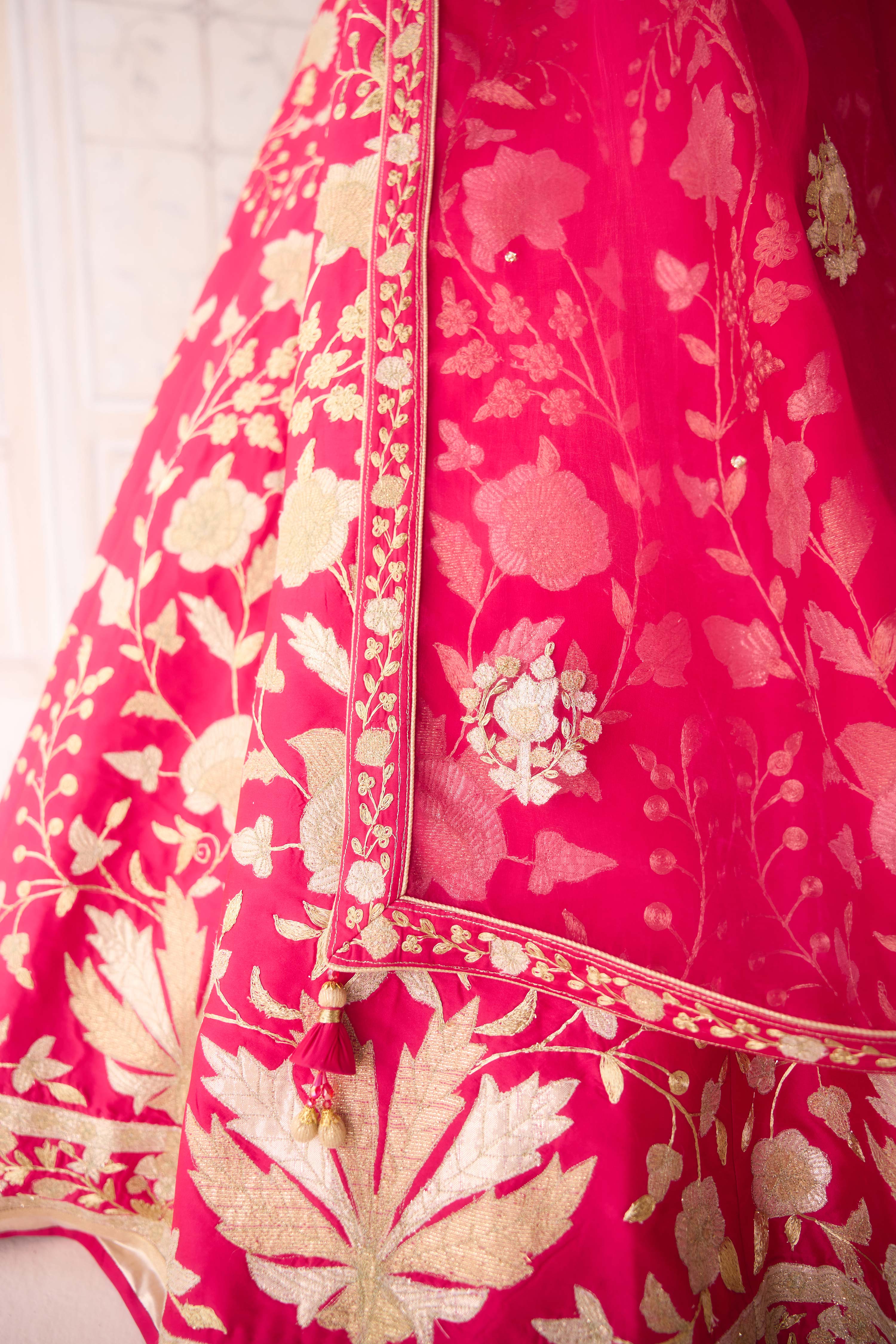 Raw silk carmine rose pink gold applique and dori embroidered lehenga set with organza dupatta