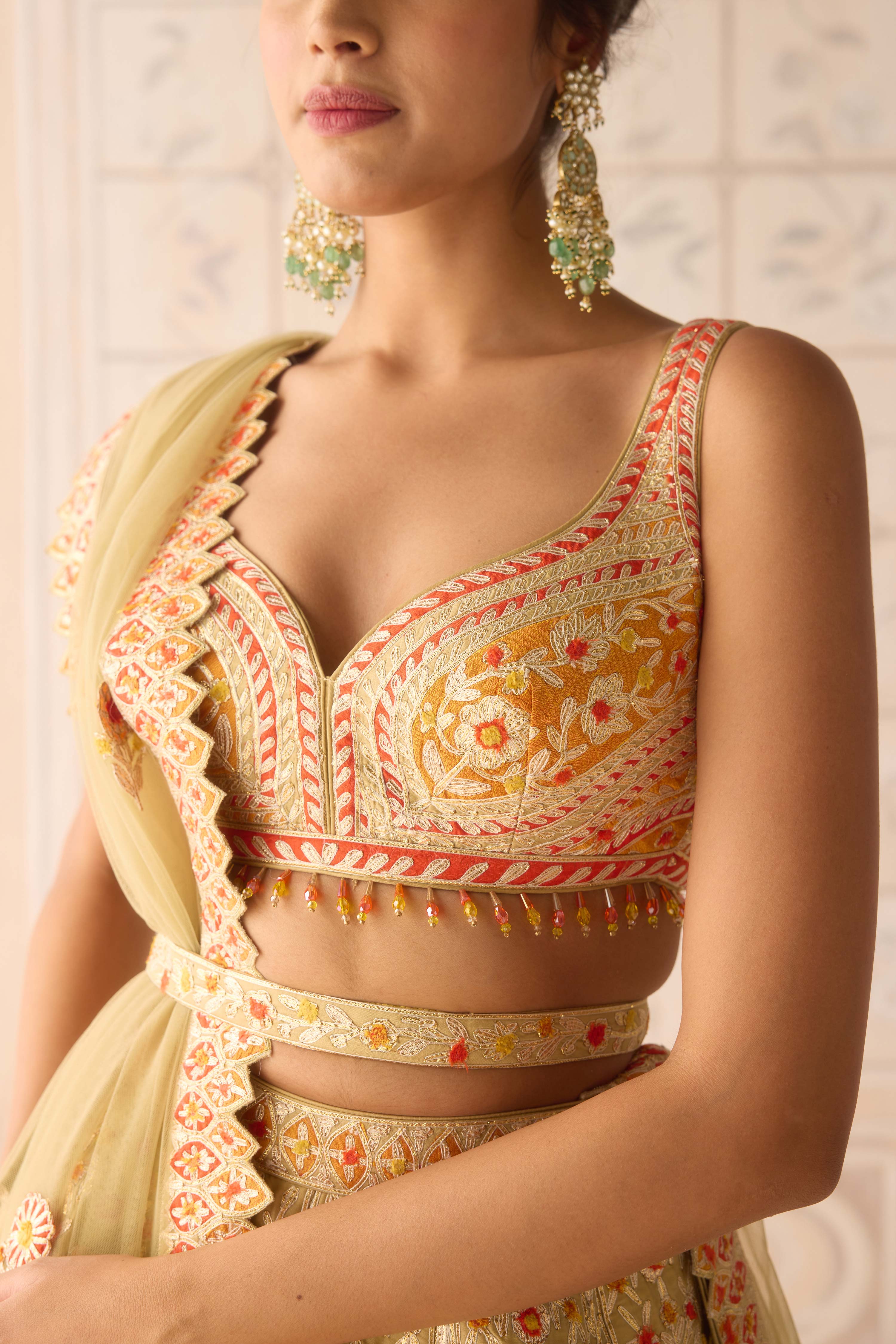 Acacia yellow multi coloured applique and gota embroidered lehenga with organza dupatta