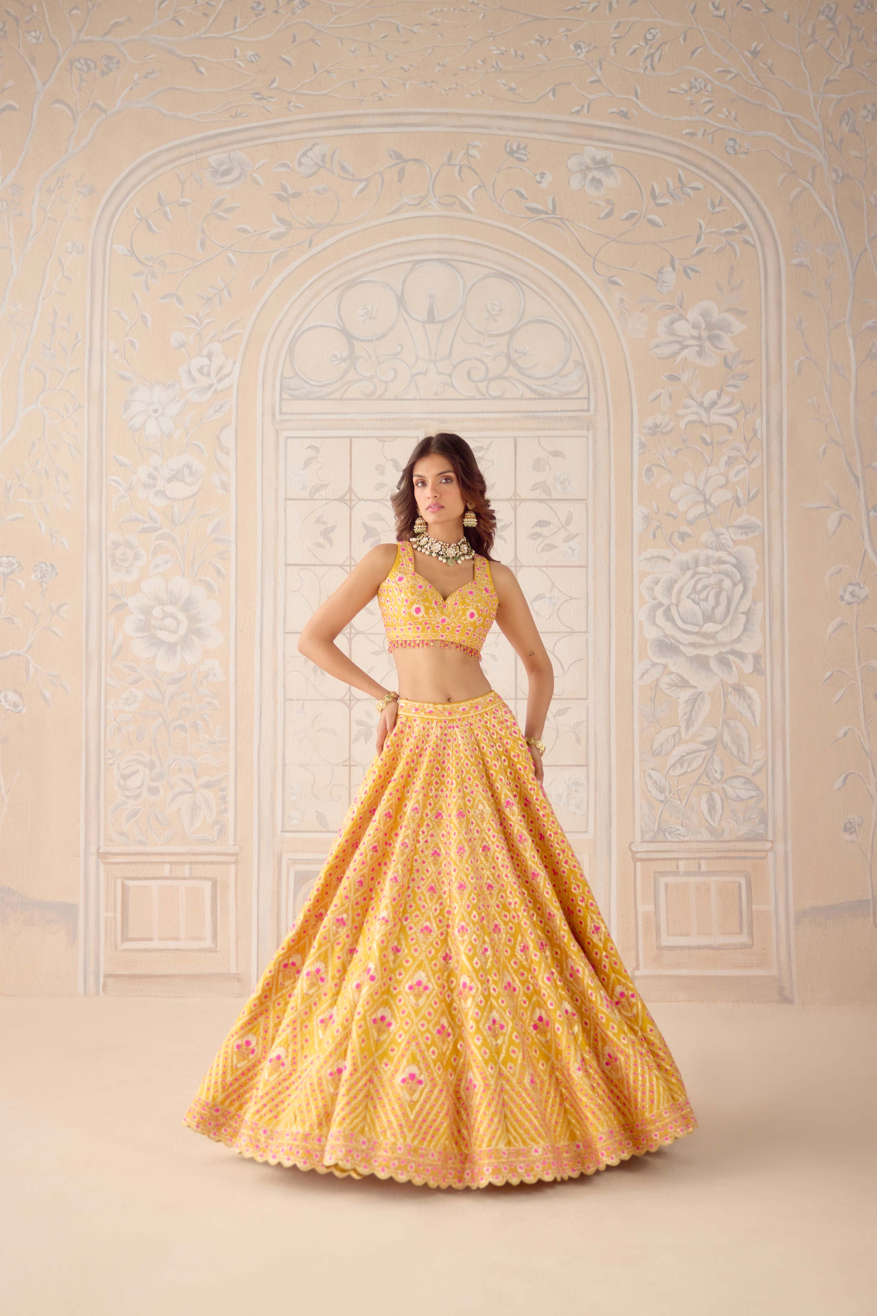 Raw silk mustard yellow gota and theread embroidered lehenga set